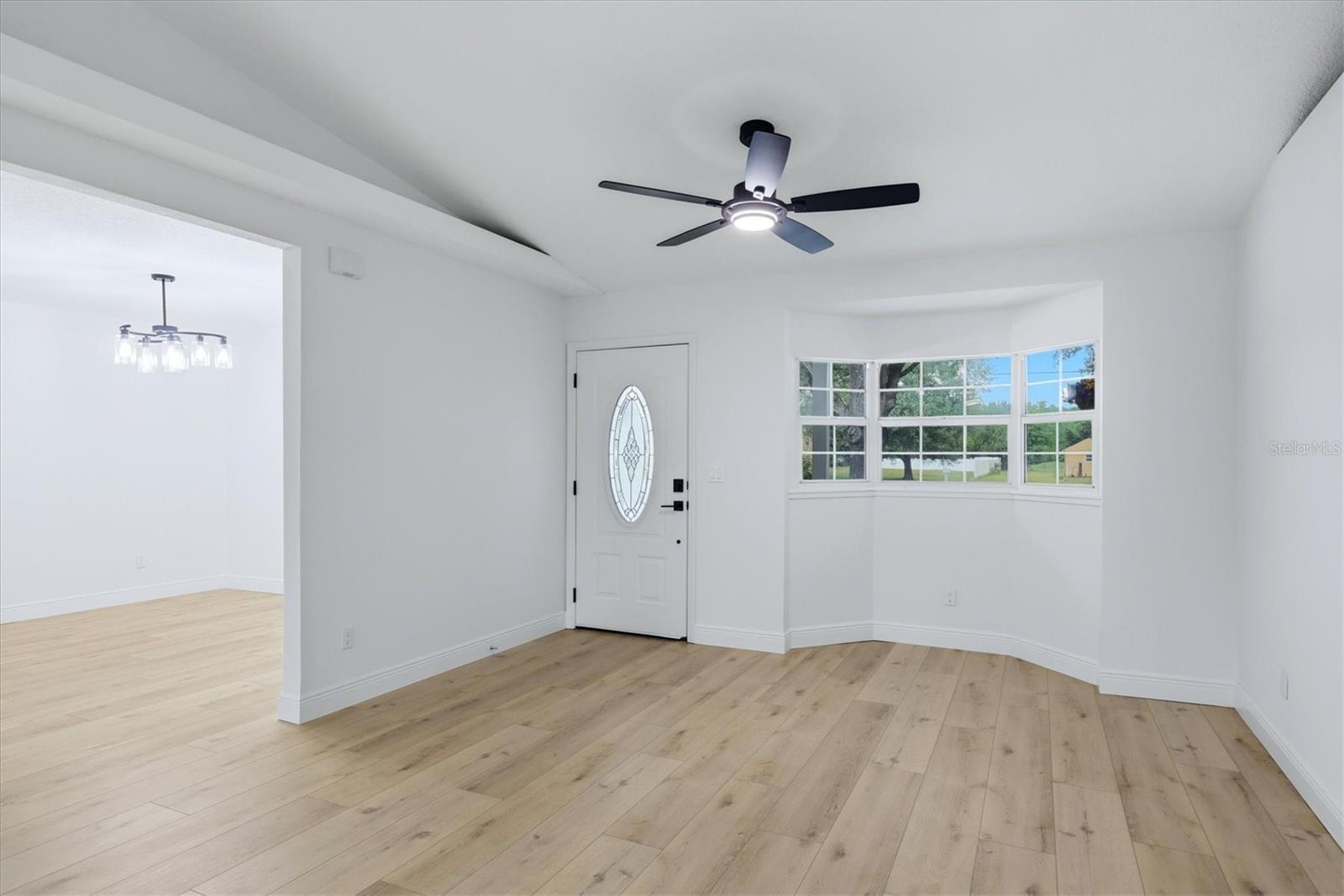 Front door entry features a bay style window