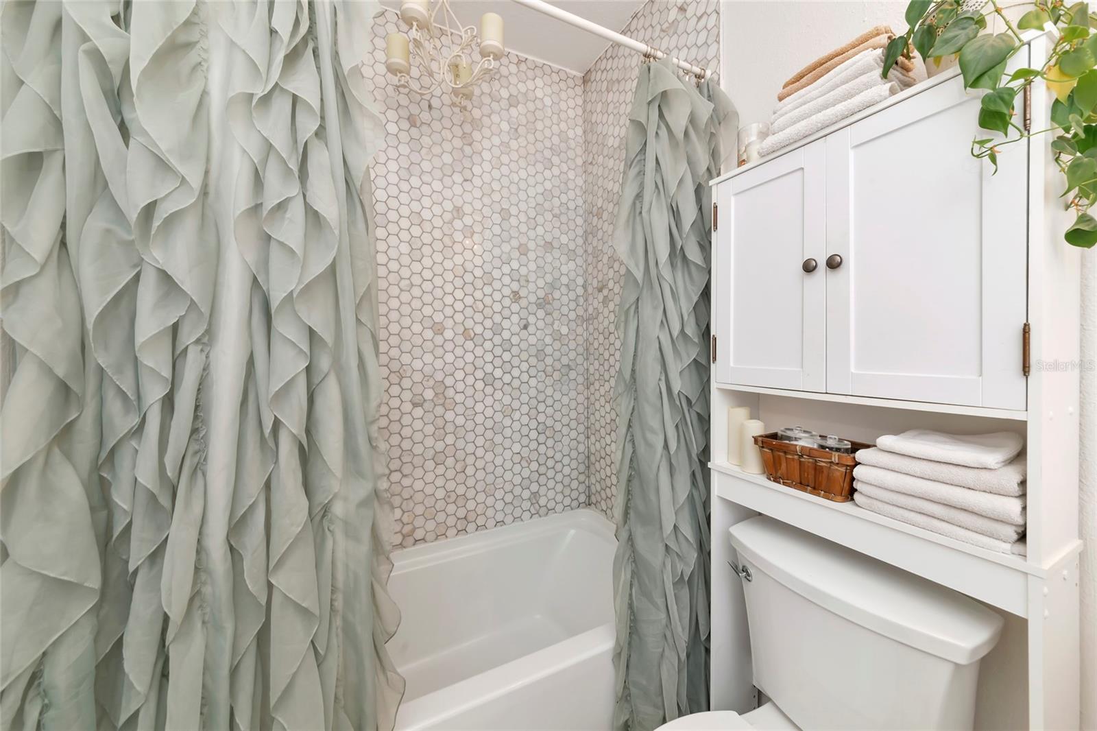 Prime bathroom with updated tile