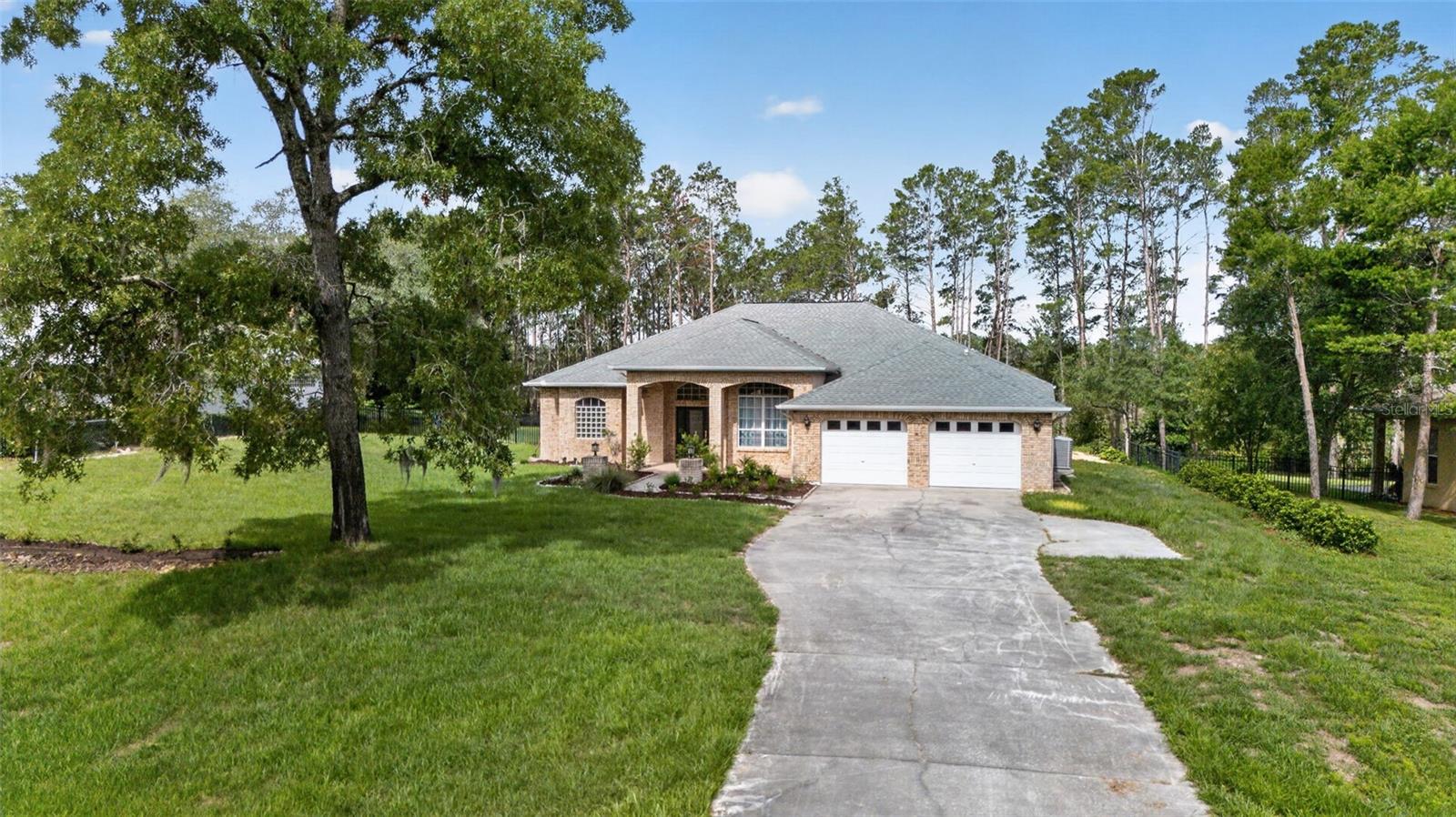 Front elevation with Oversized driveway and new landscaping