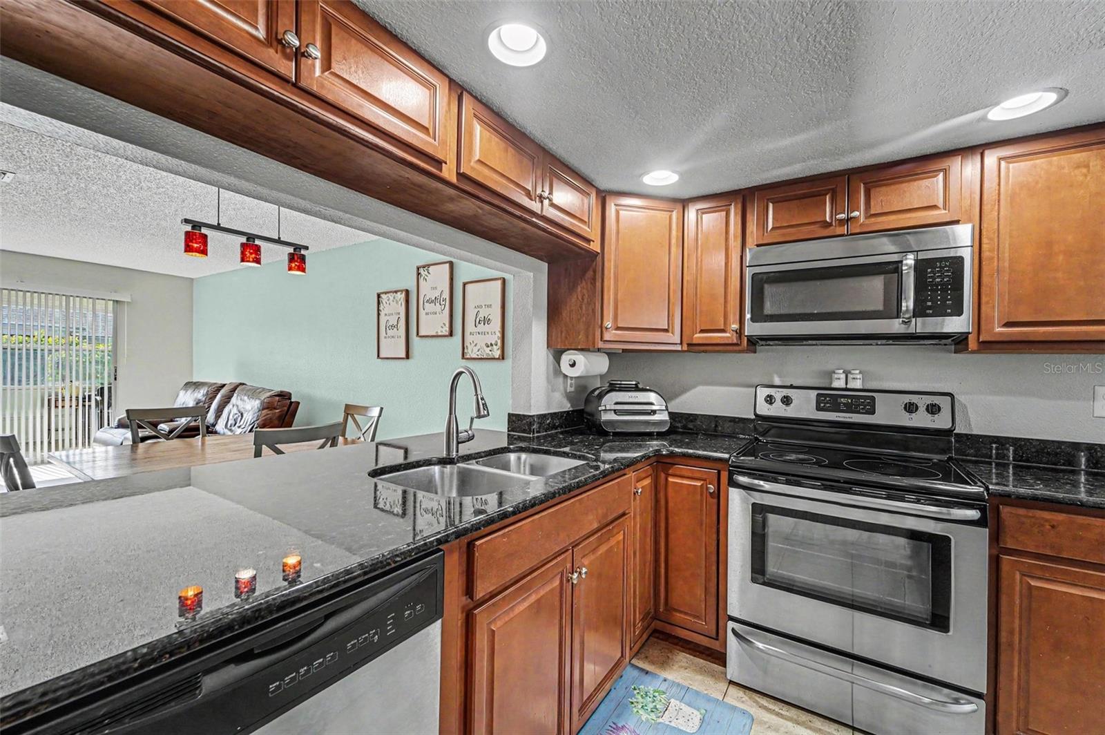 Kitchen with view into the living and dining area