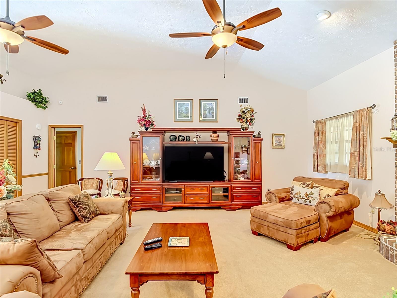 LIVING/GREAT ROOM WITH DOUBLE CEILING FANS