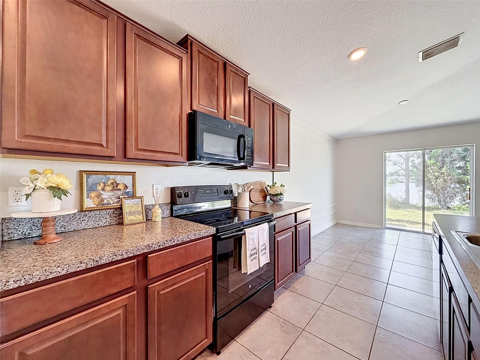 BIG, well-lit kitchen. Open to gathering spaces.