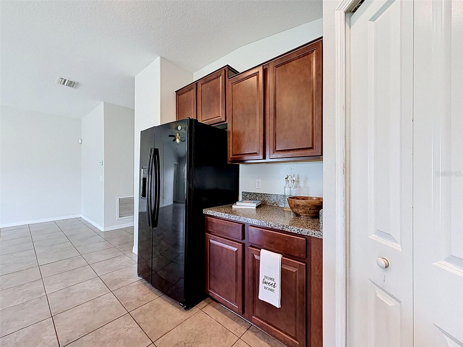 BIG, well-lit kitchen. Open to gathering spaces.