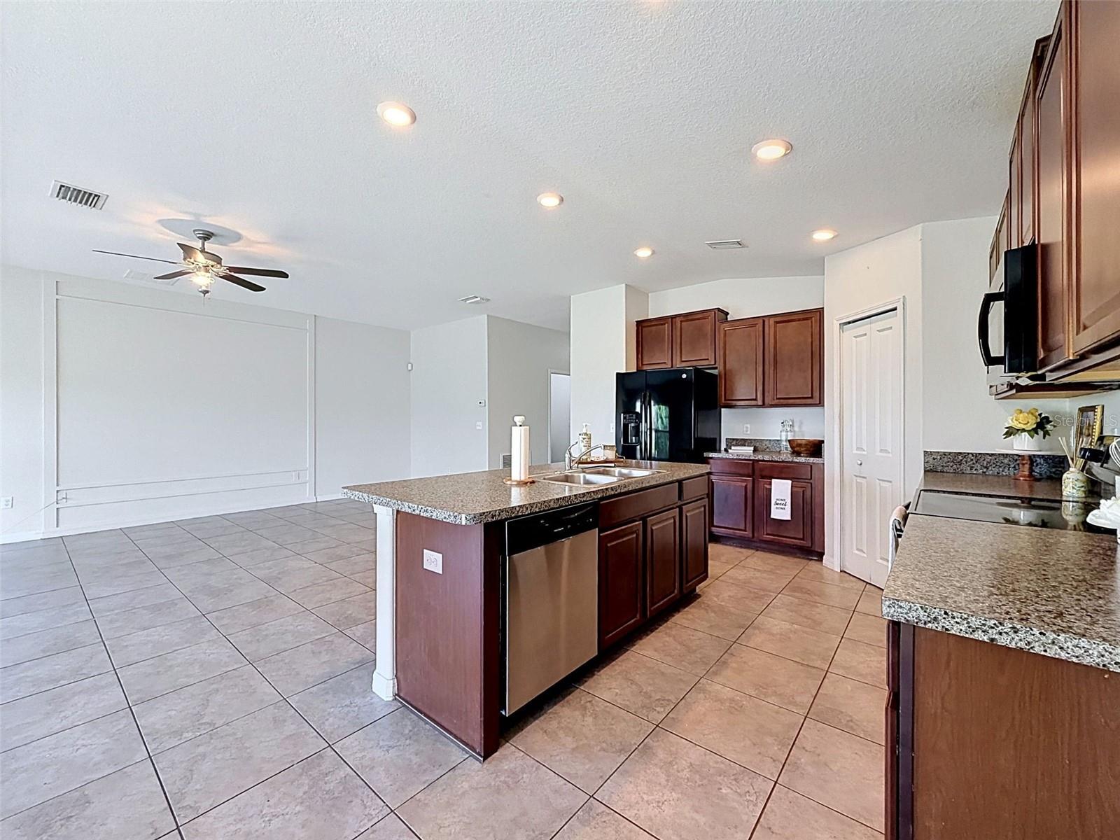 BIG, well-lit kitchen. Open to gathering spaces.