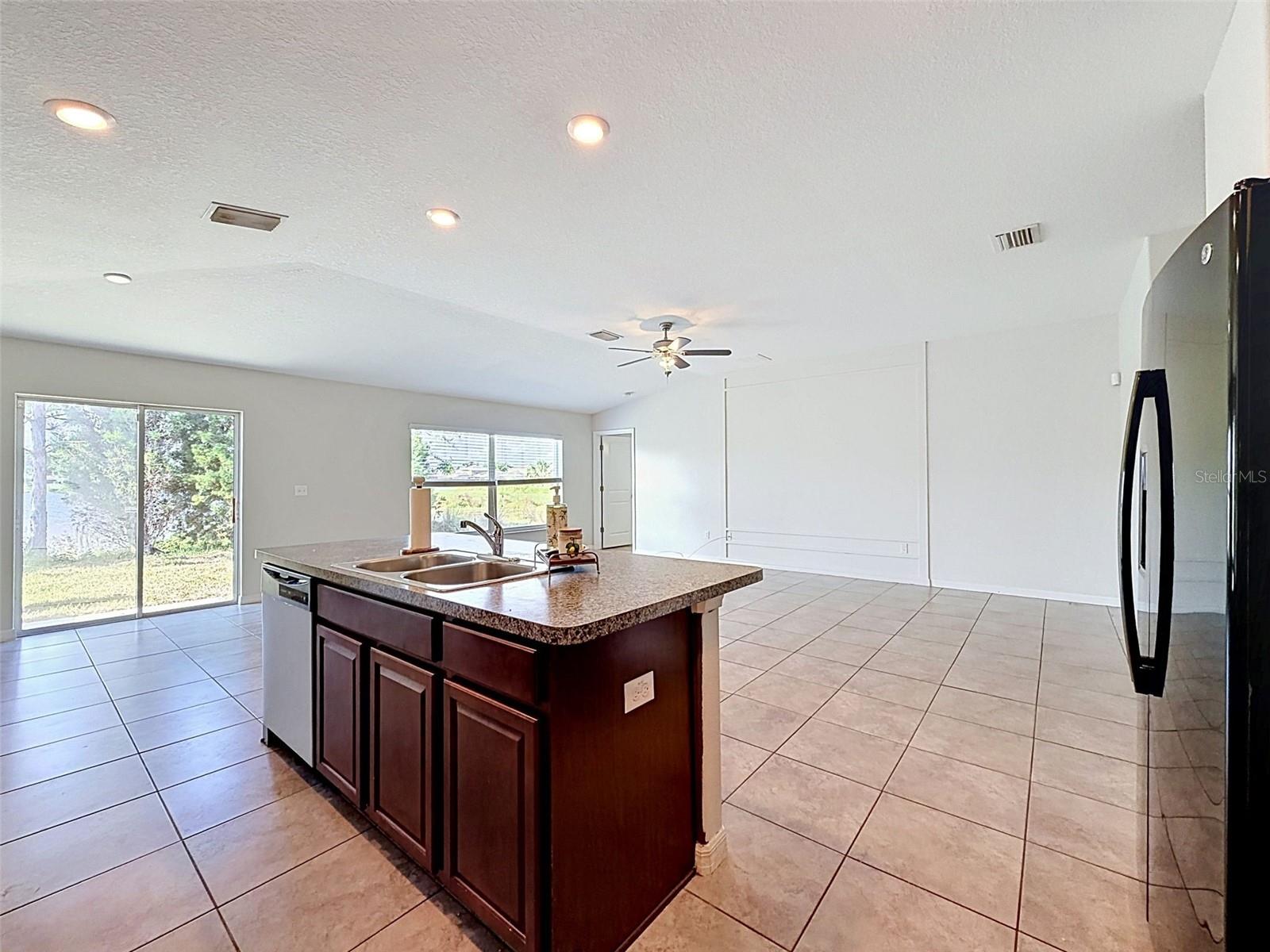 BIG, well-lit kitchen. Open to gathering spaces.