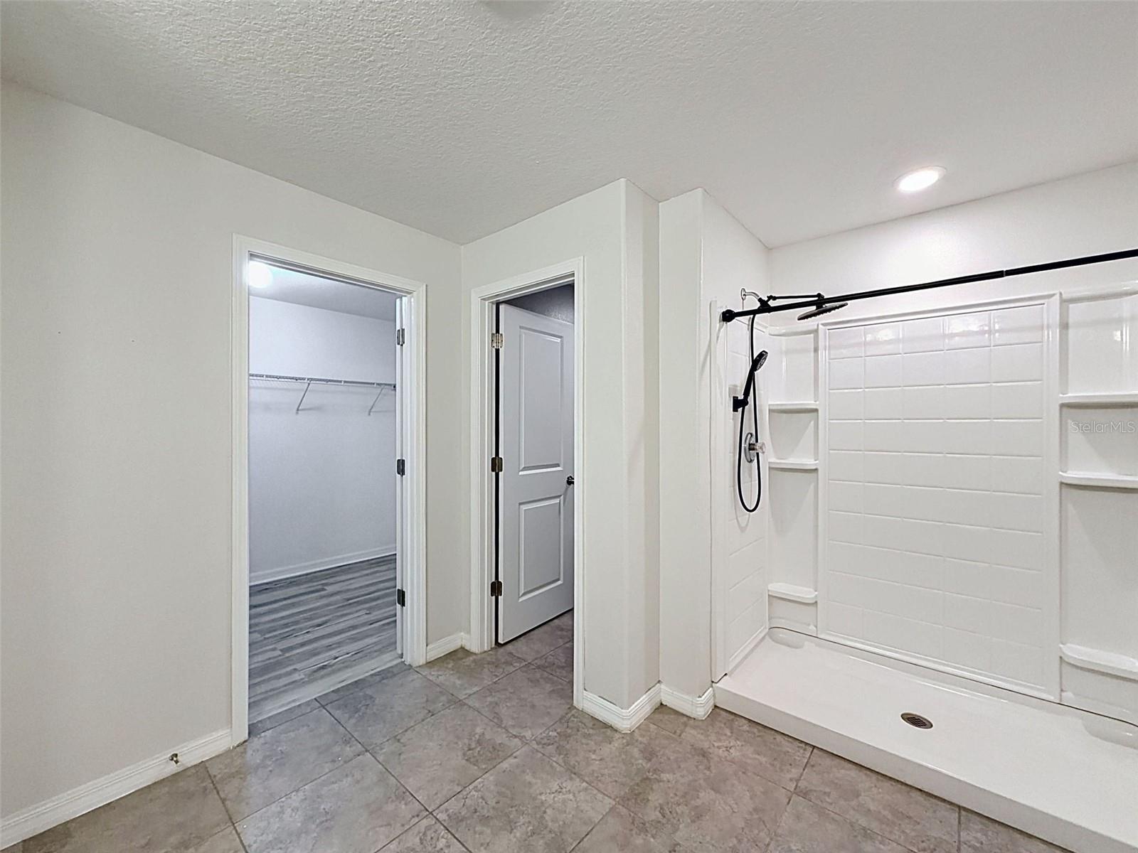 Big master bathroom easily accommodates two.