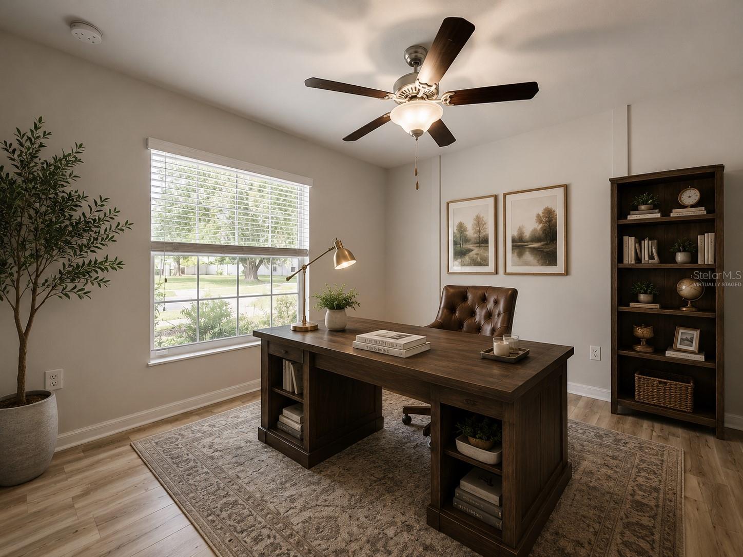 Virtually staged bedroom used as a home office.