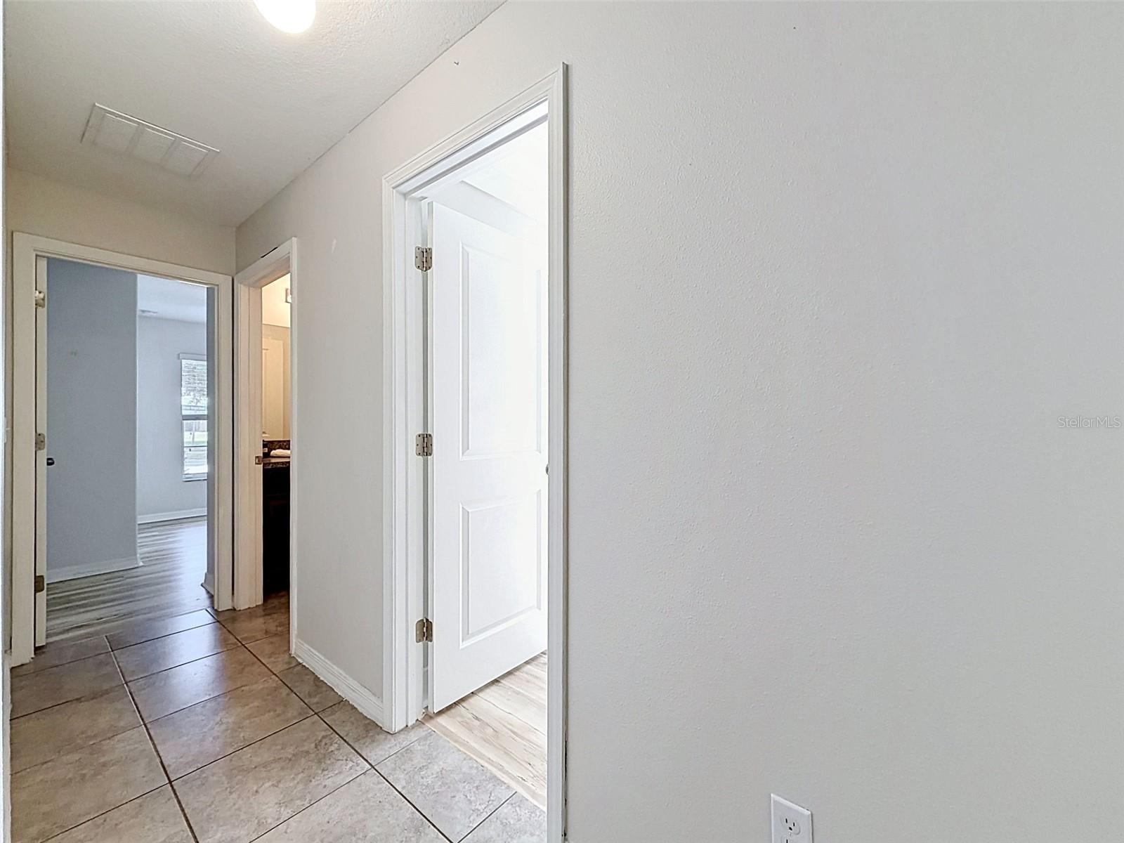 Hallway to two bedrooms and bath.