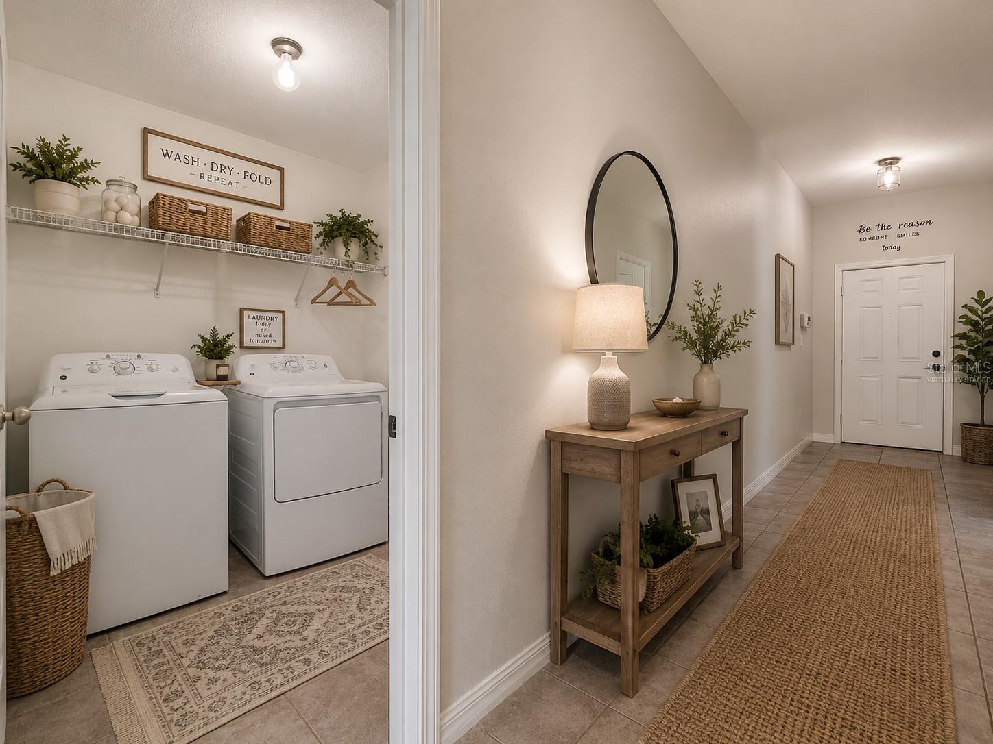 Foyer leading to laundry room and garage. Virtually staged.