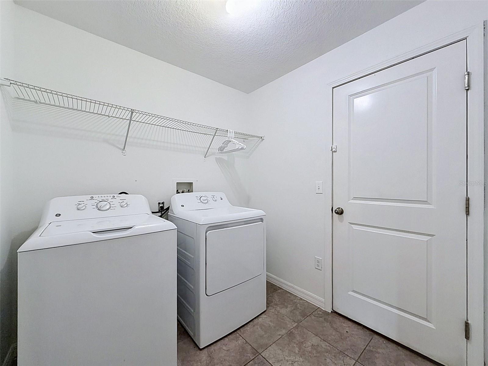 Laundry room leading to garage.