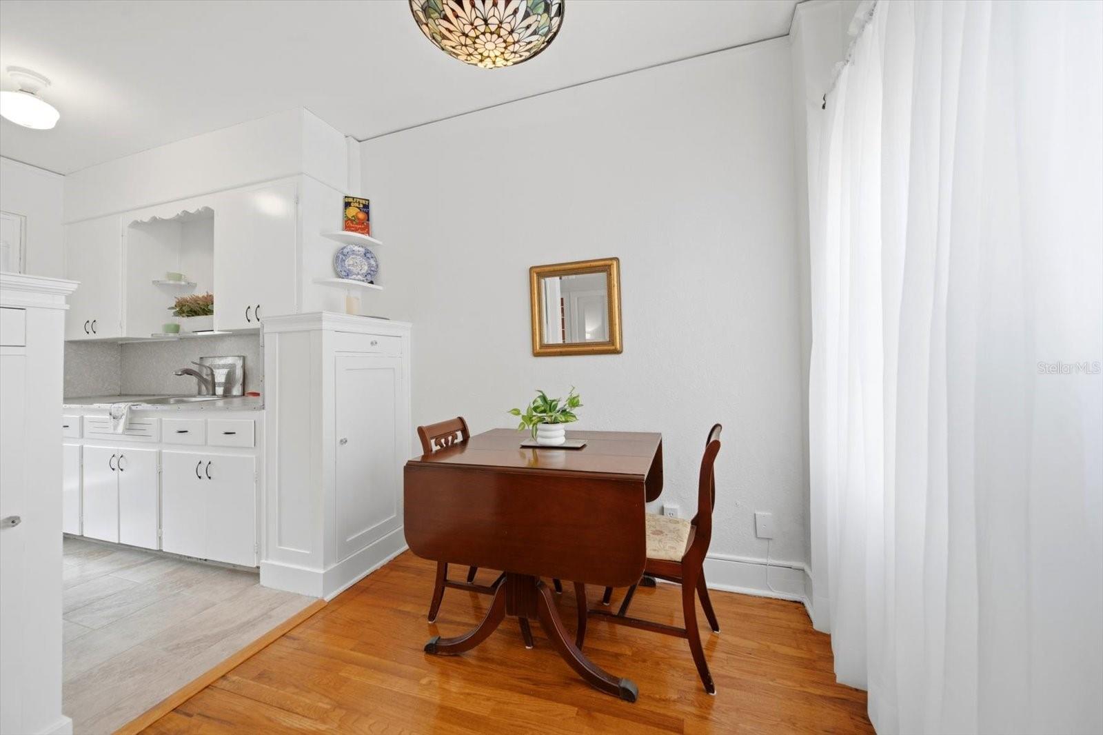 The dining table opens to comfortable seat four dinner guests.