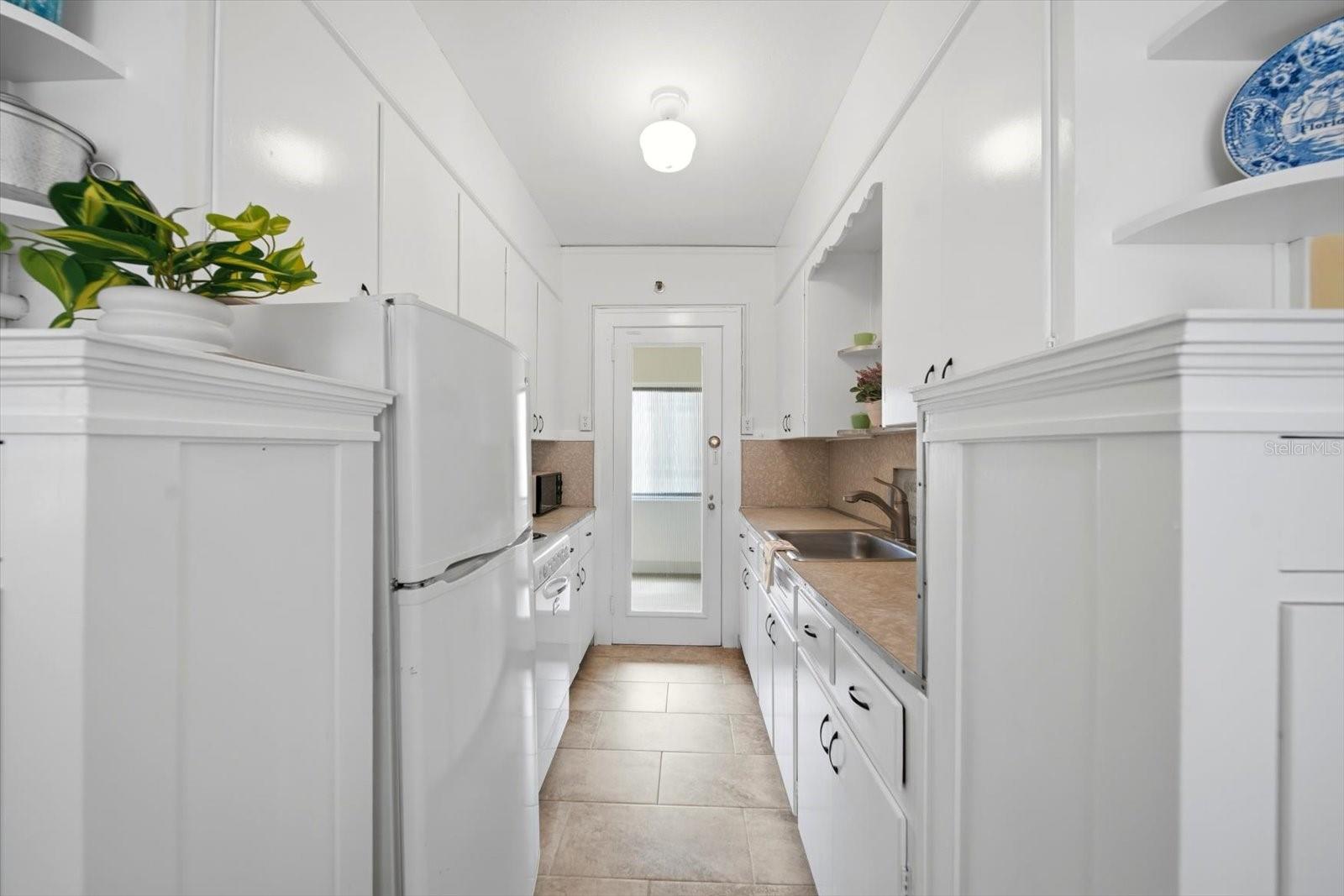New tile was recently installed in the kitchen.