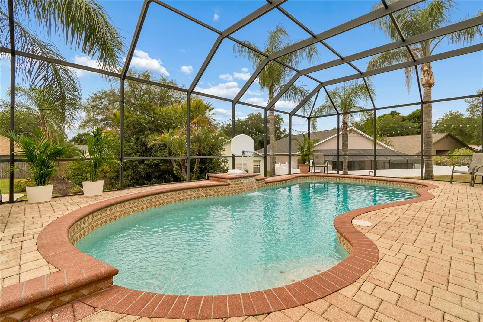 The heated sparkling pool creates an impressive backyard retreat