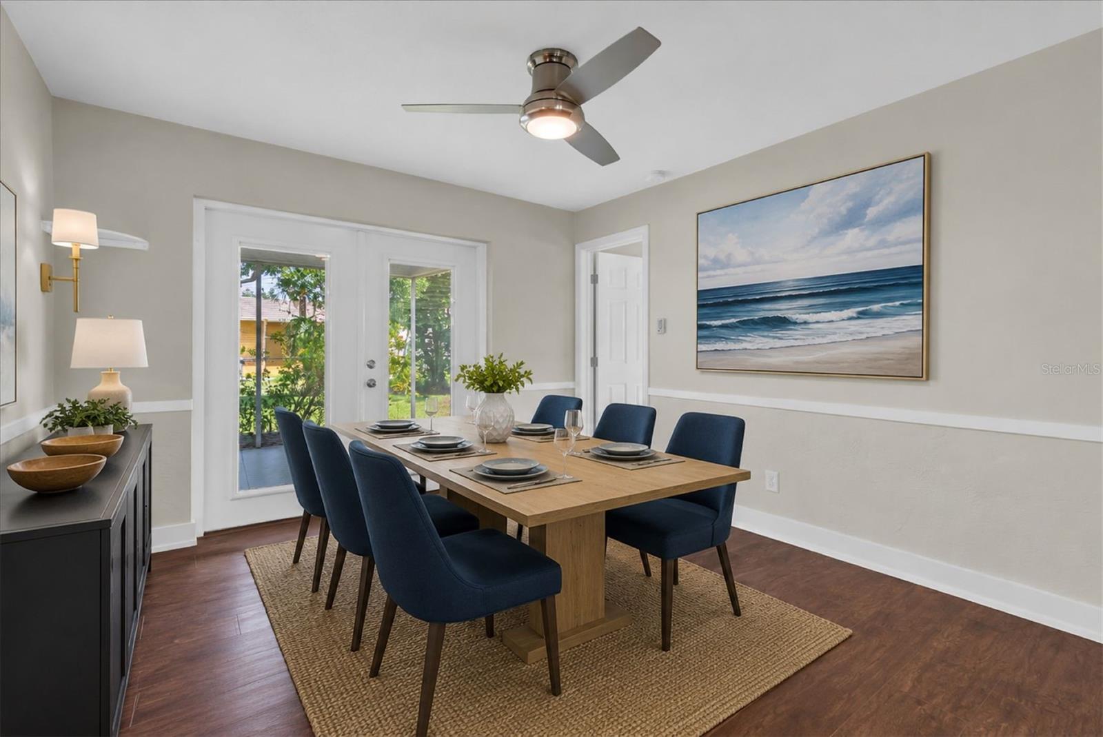 Dining room with chair rail detailing and abundant natural light