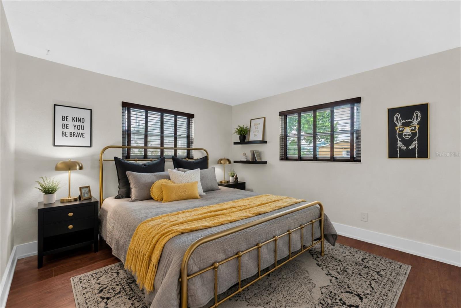 Guest bedroom with bright windows and flexible layout