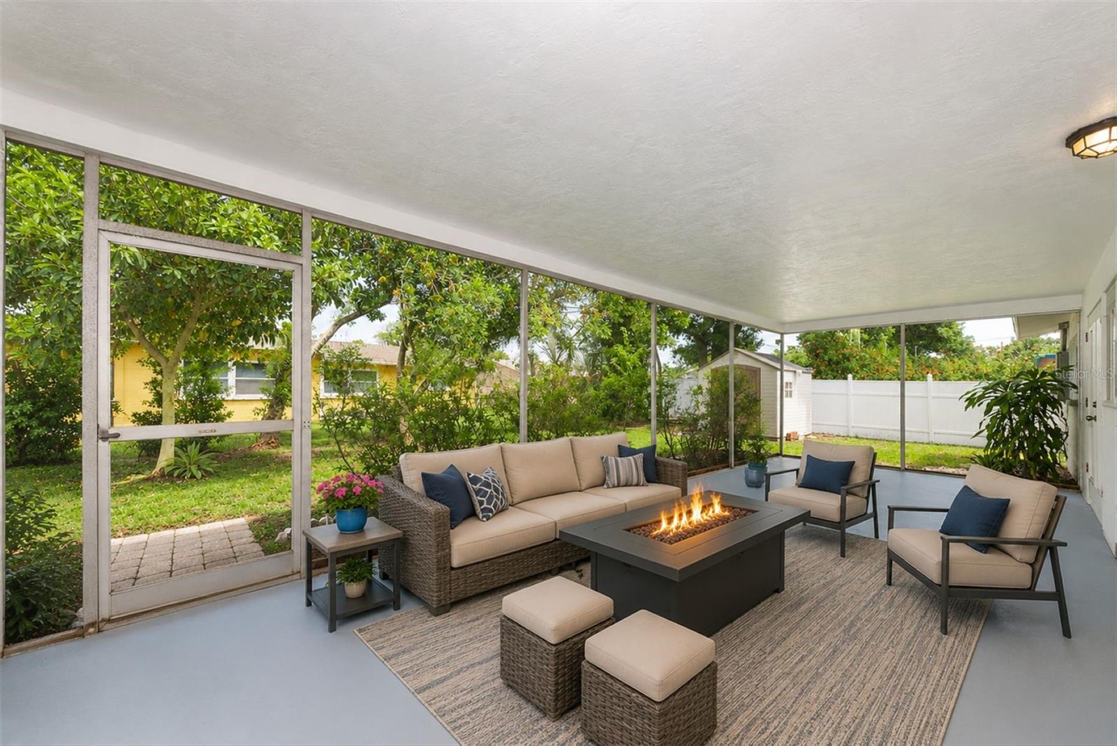 Expansive screened porch ideal for relaxing and entertaining year-round