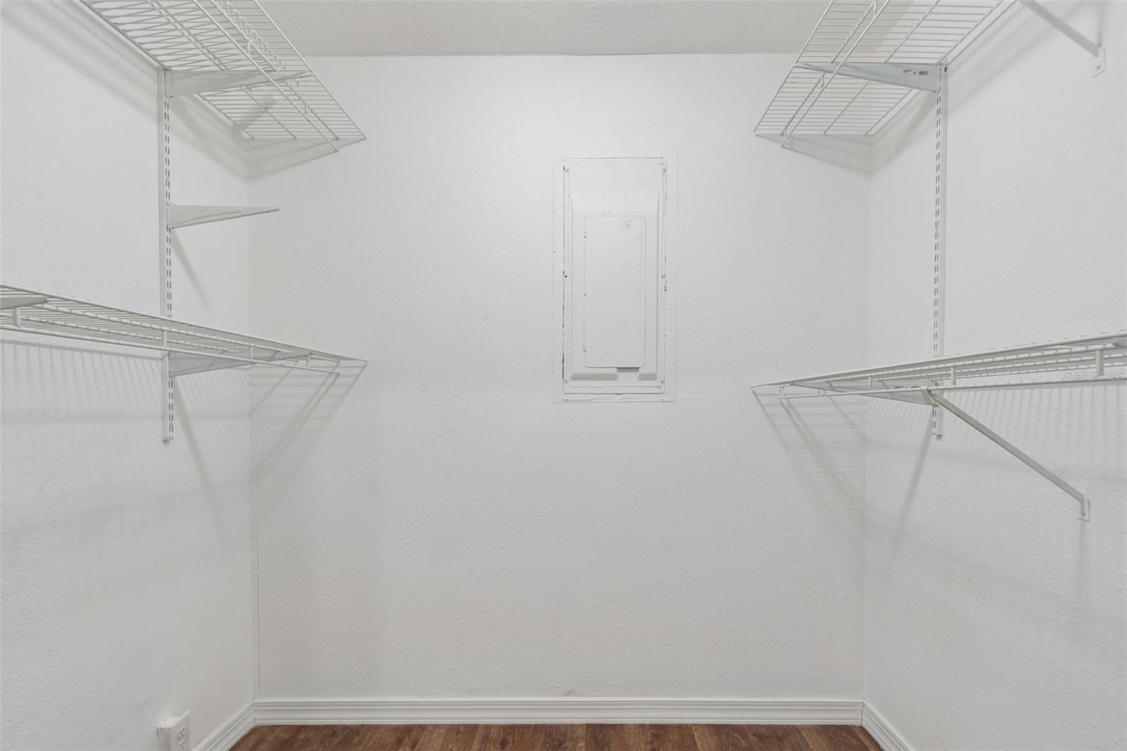 Primary bedroom walk in closet