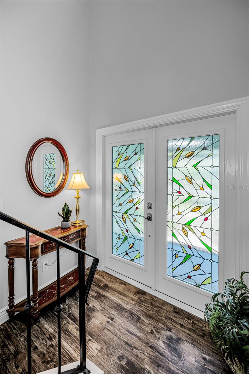 Step inside your screened front porch into this light and bright exceptional residence.
