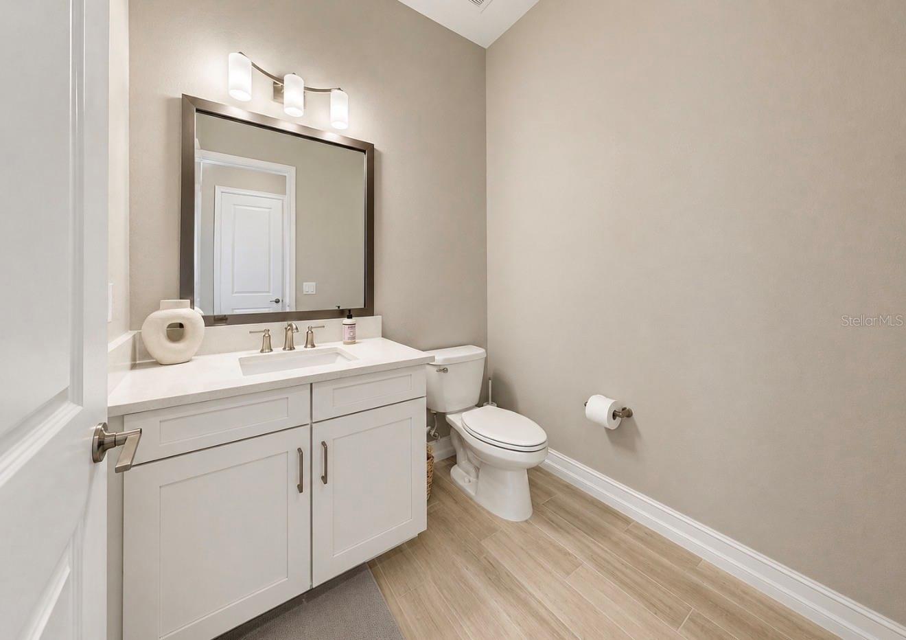 Half Bath located in hallway with flex/extra bedroom located on floor 1