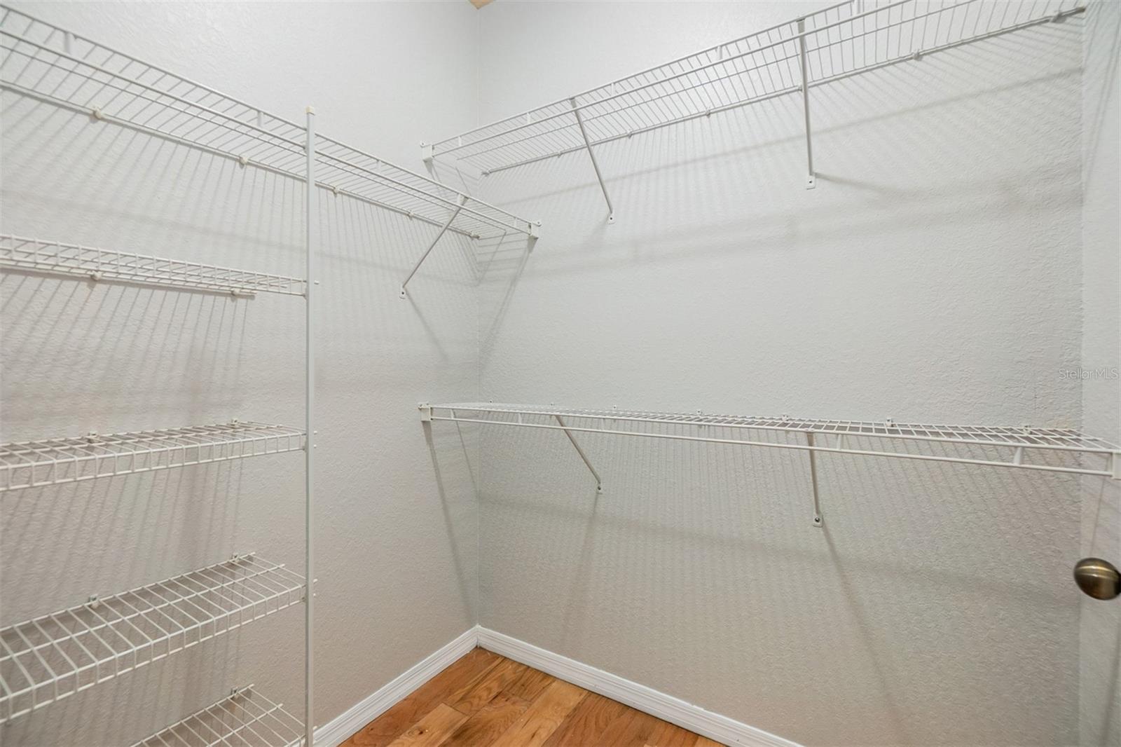 Walk in closet in primary bedroom