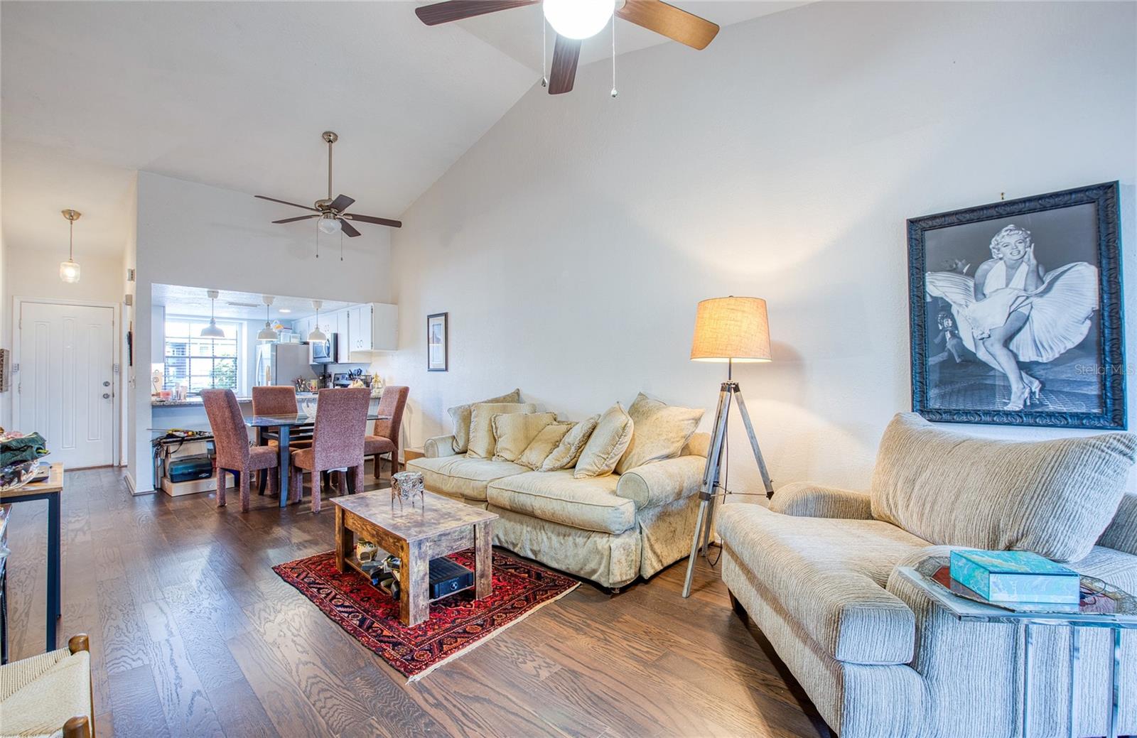 Spacious open floor plan with vaulted ceilings and luxury vinyl floors