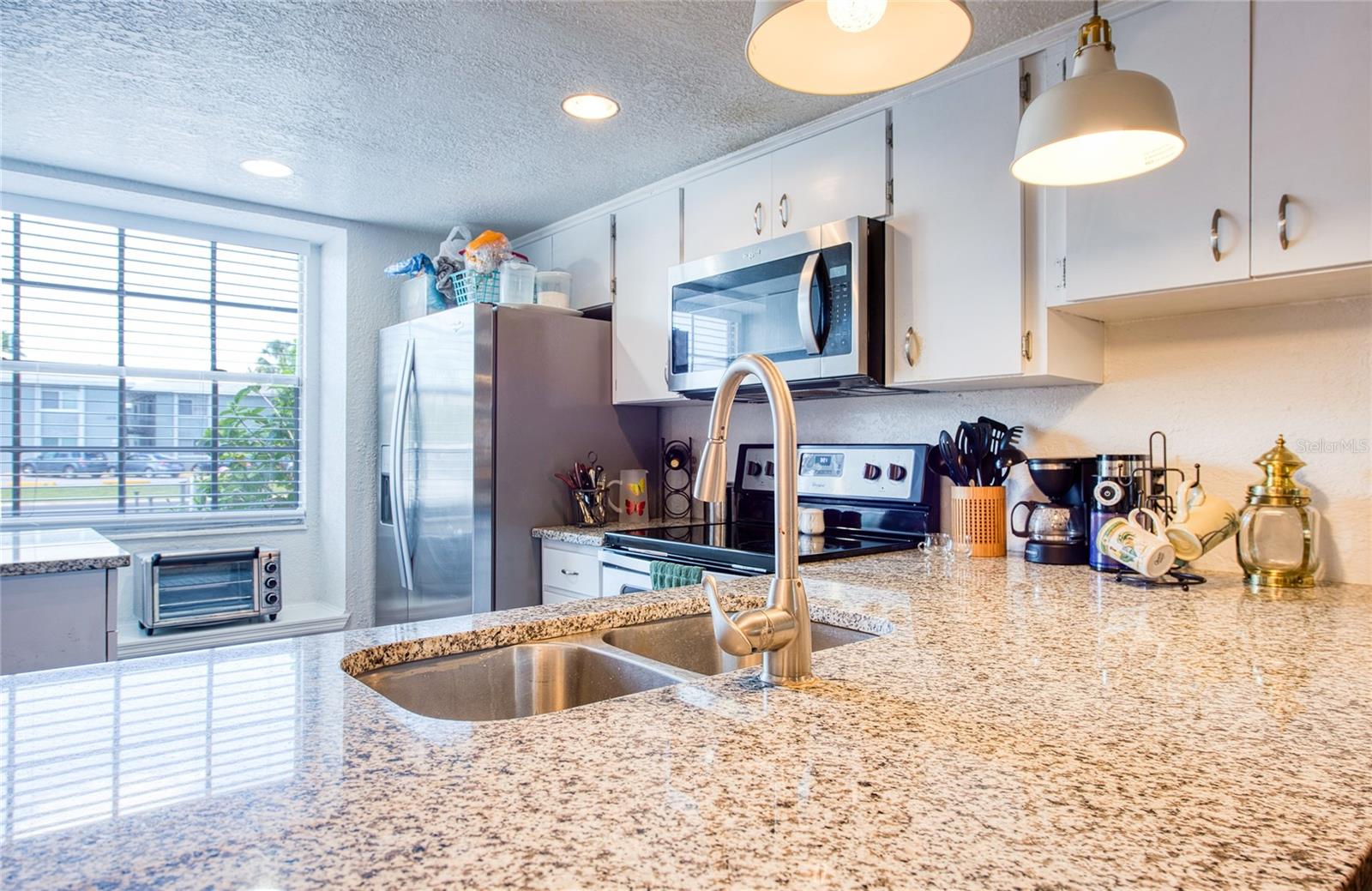 Bright and open Concept Kitchen with Bay window and  Breakfast bar
