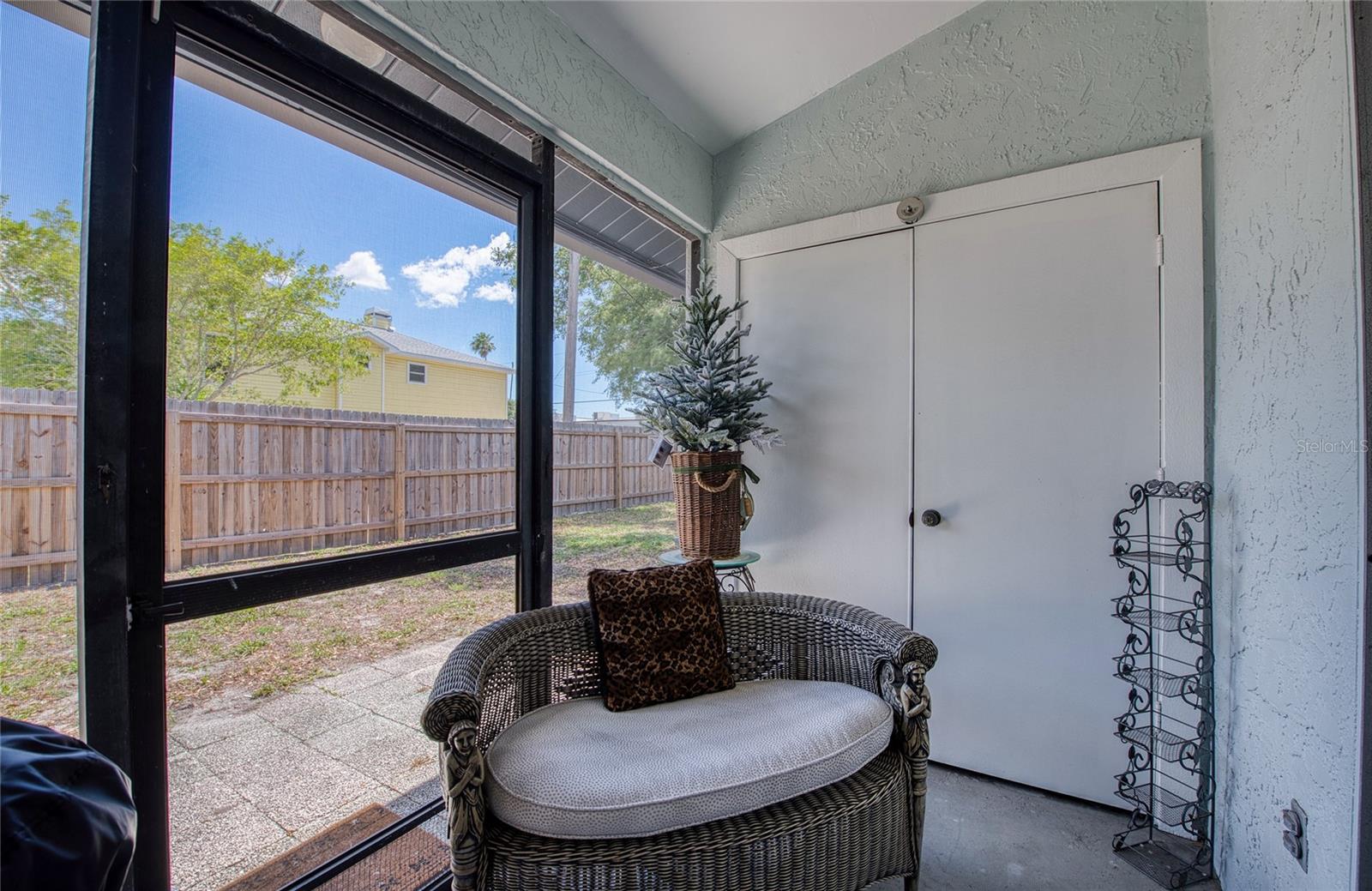 Screened Patio with large storage closet. Patio with fenced in yard.
