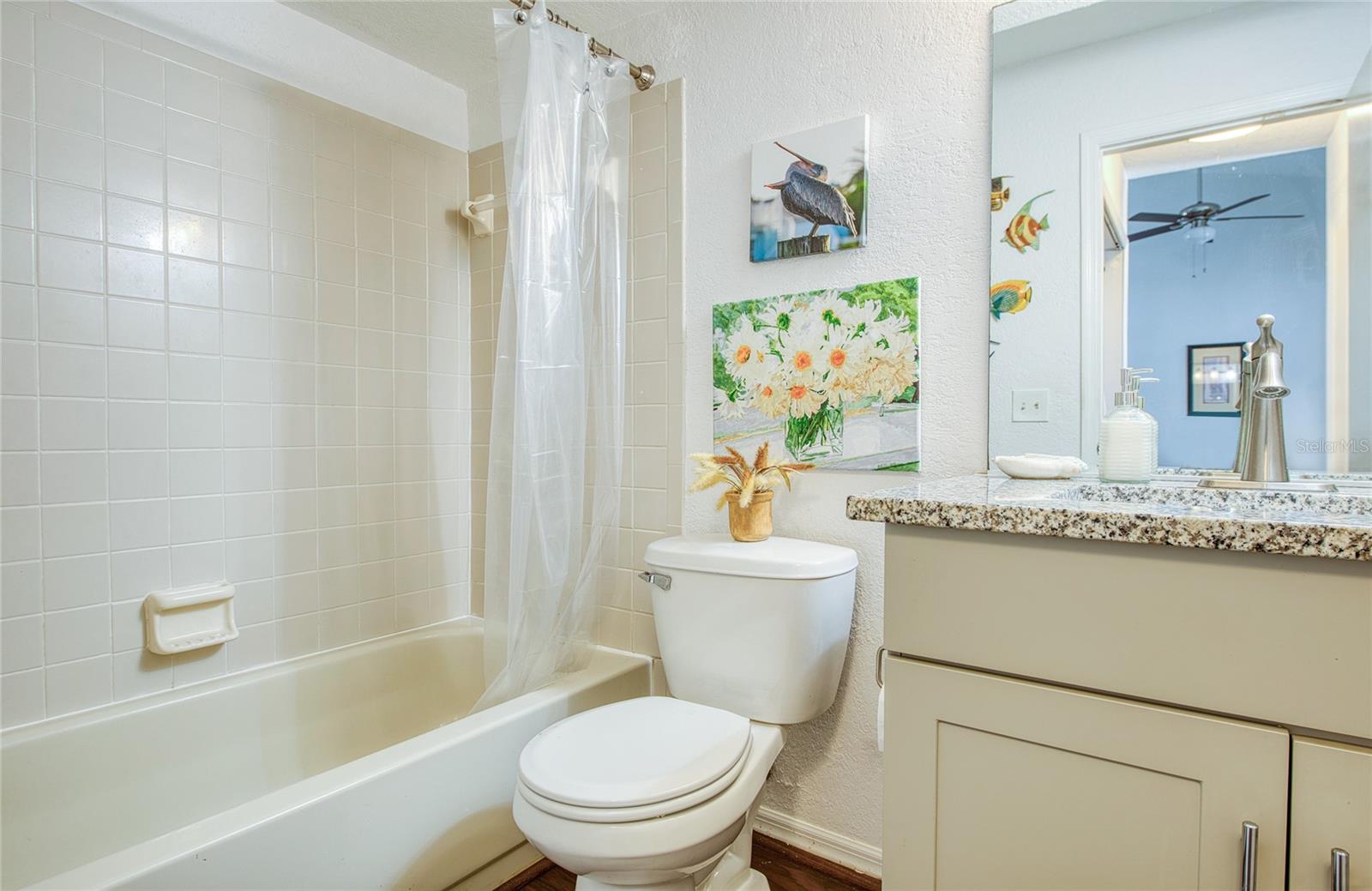 guest bath with tub and shower. primary bath not pictured