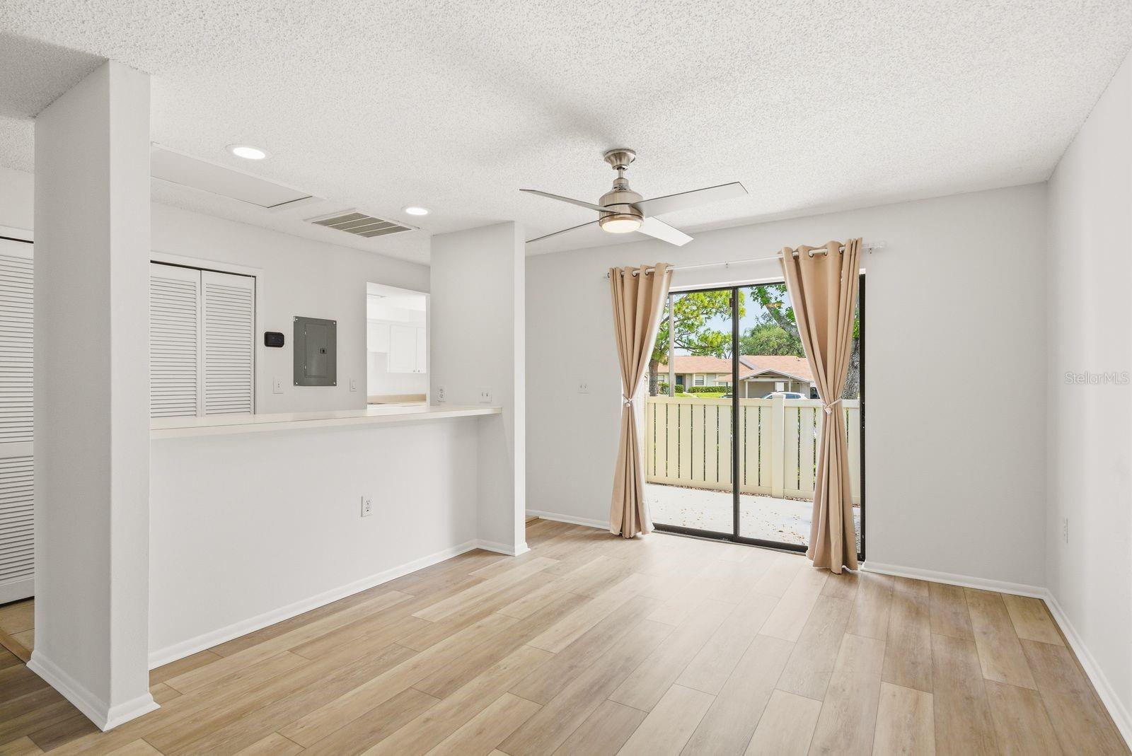 Dining area and breakfast bar connecting to kitchen