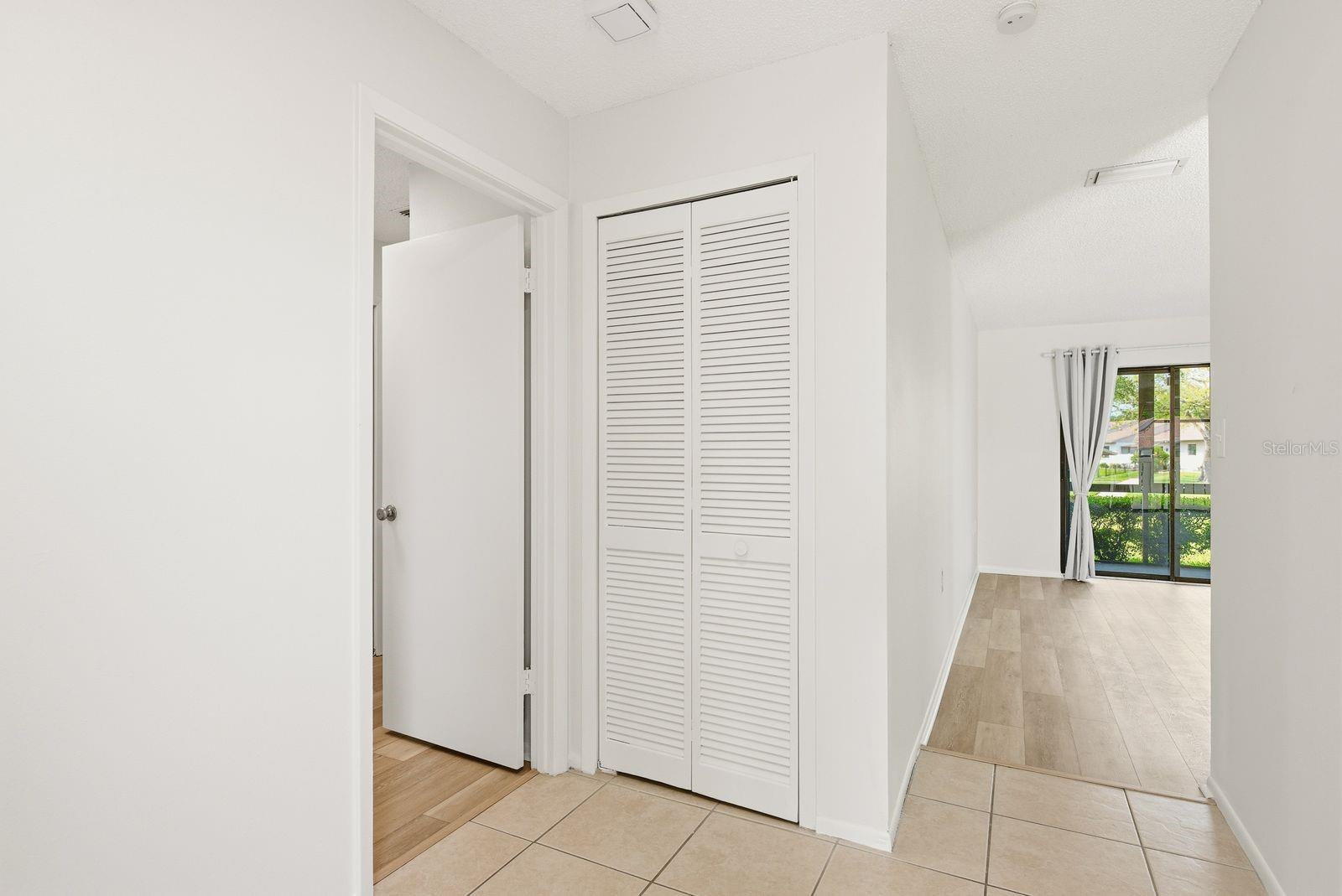 Coat closet and entry to owner suite