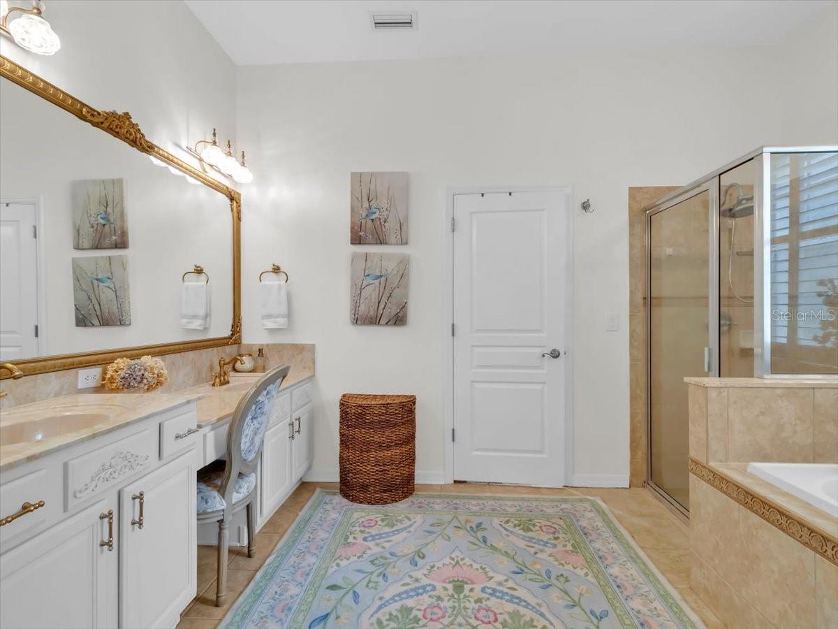 Spacious Primary Ensuite Bathroom features double sinks, Vanity/ Makeup area, Walk in shower, Jetted tub for relaxing, HUGE WALK Clothing closet & a Private water closet.