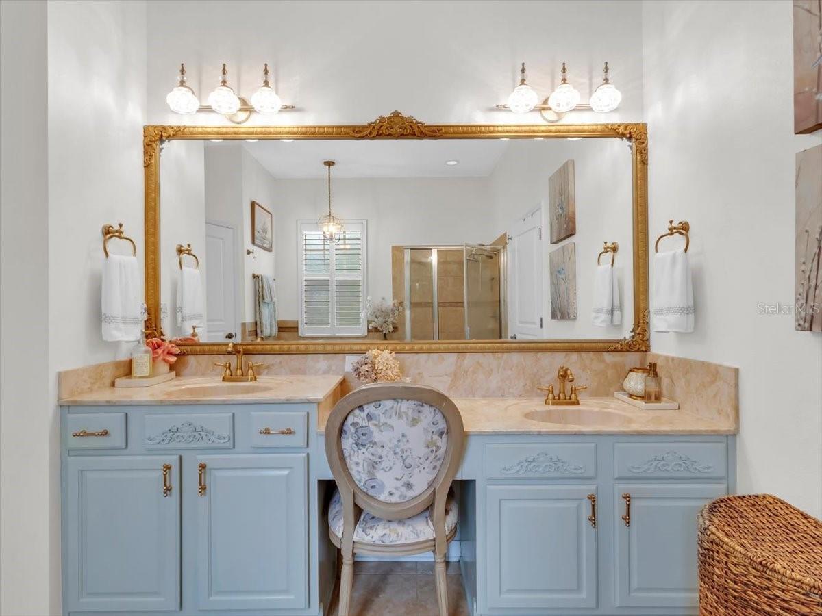 Primary Bath Vanity View- Updated lighting, Mirror, fixtures and cabinet.