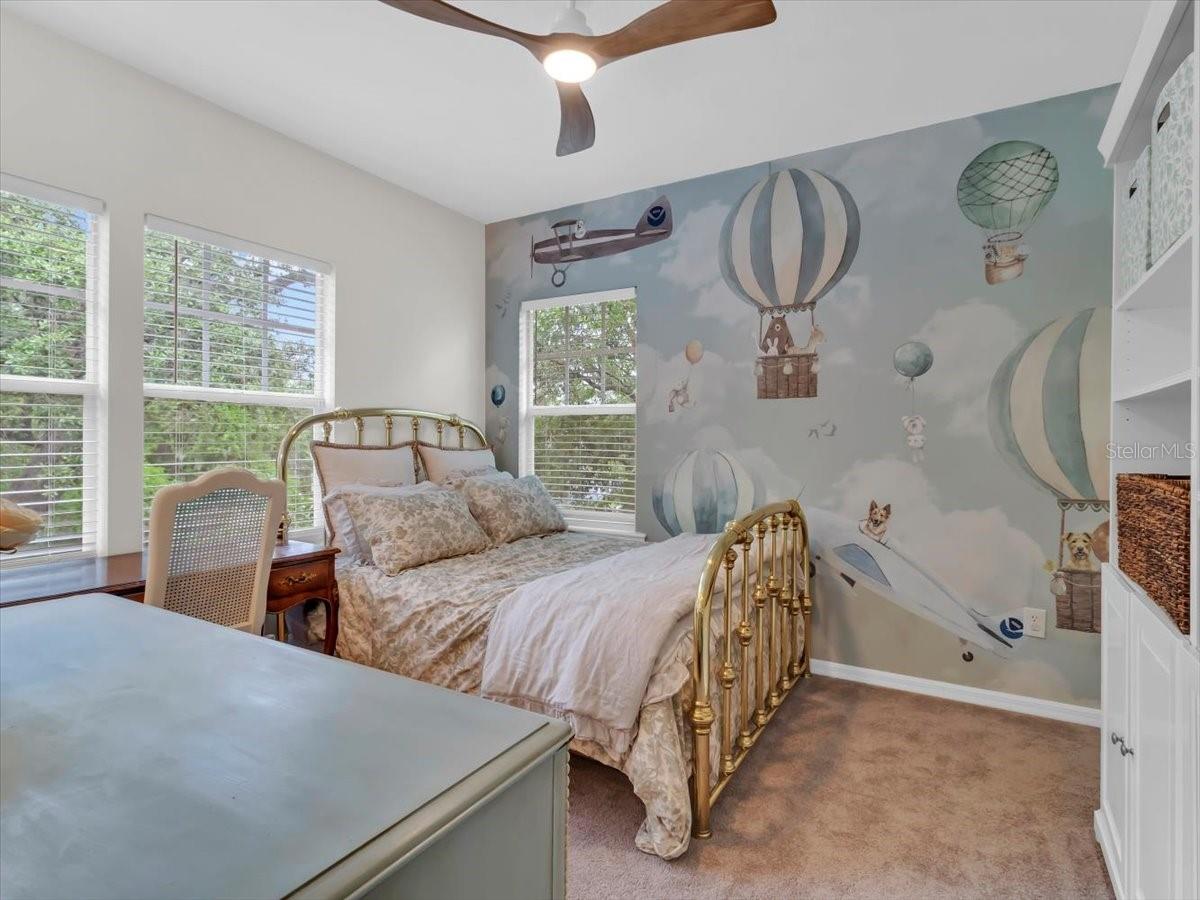 Bedroom 2 Features a NICE Walk in closet and Jack n Jill Vanities and Bathroom . Cute Airman themed Wallpaper