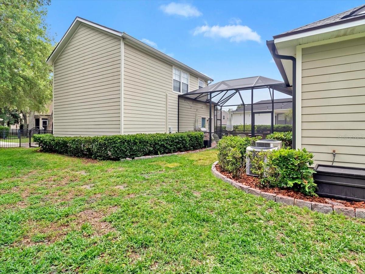 Side/ Rear Fenced Yard/ Garage view.