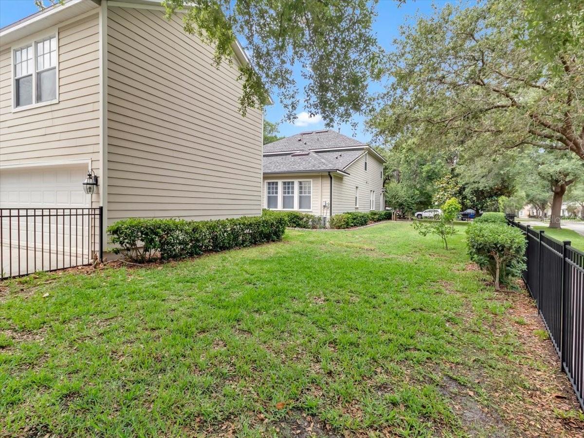 FULL CORNER LOT, Fenced with Black aluminum Fencing. Plenty of room for a pet or soccer team!