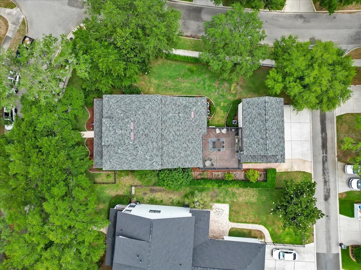 Aerial shows off the NEW ROOF and Spacious Fenced YARD! Ample parking in the rear!