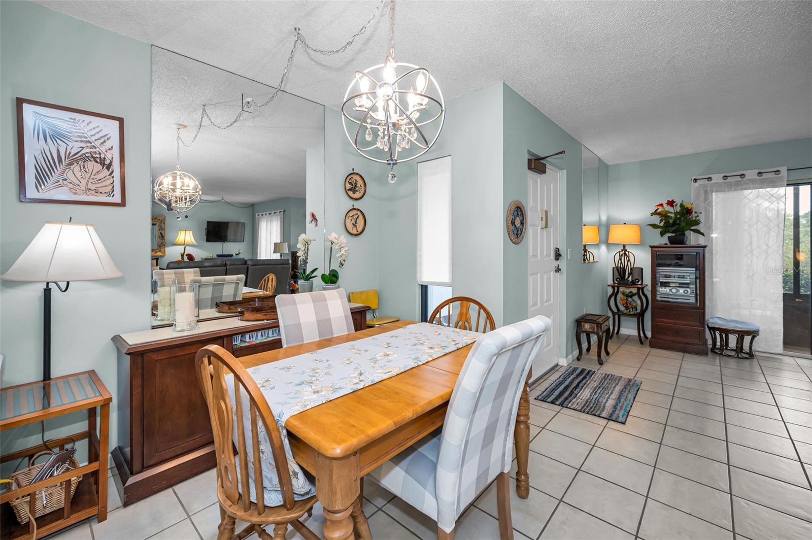 View of dinette area toward front door & sliding doors