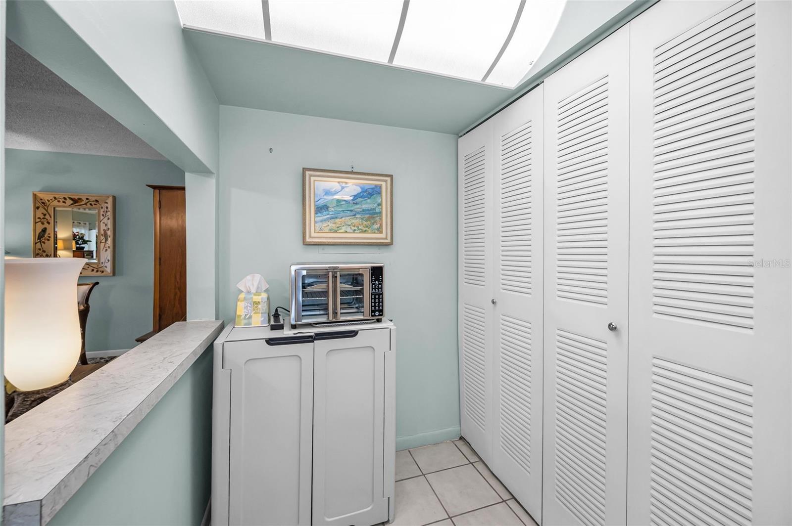 Extended kitchen area with hvac & washer/dryer closet
