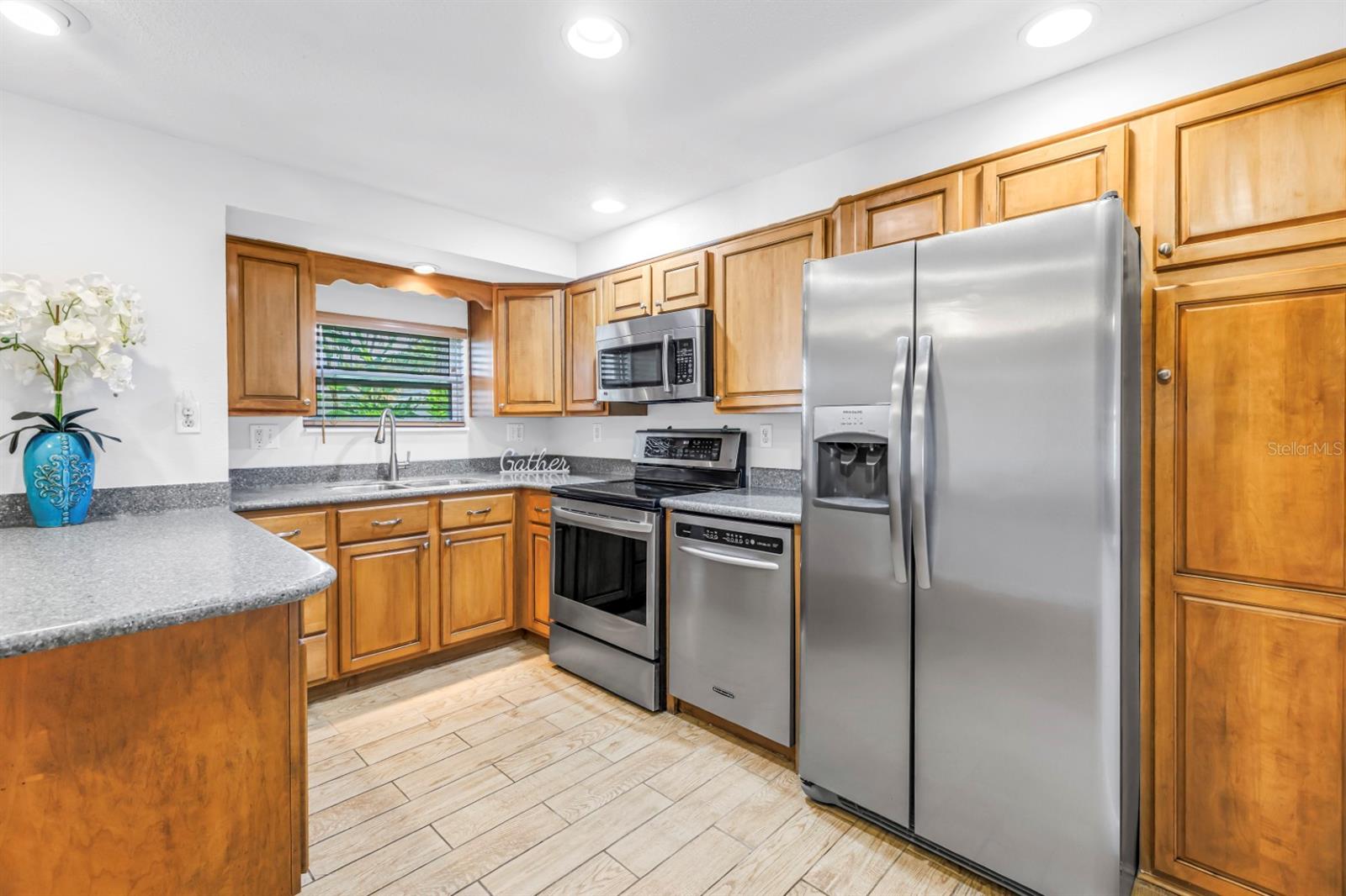 Solid wood cabinetry, Corian countertops, stainless appliances