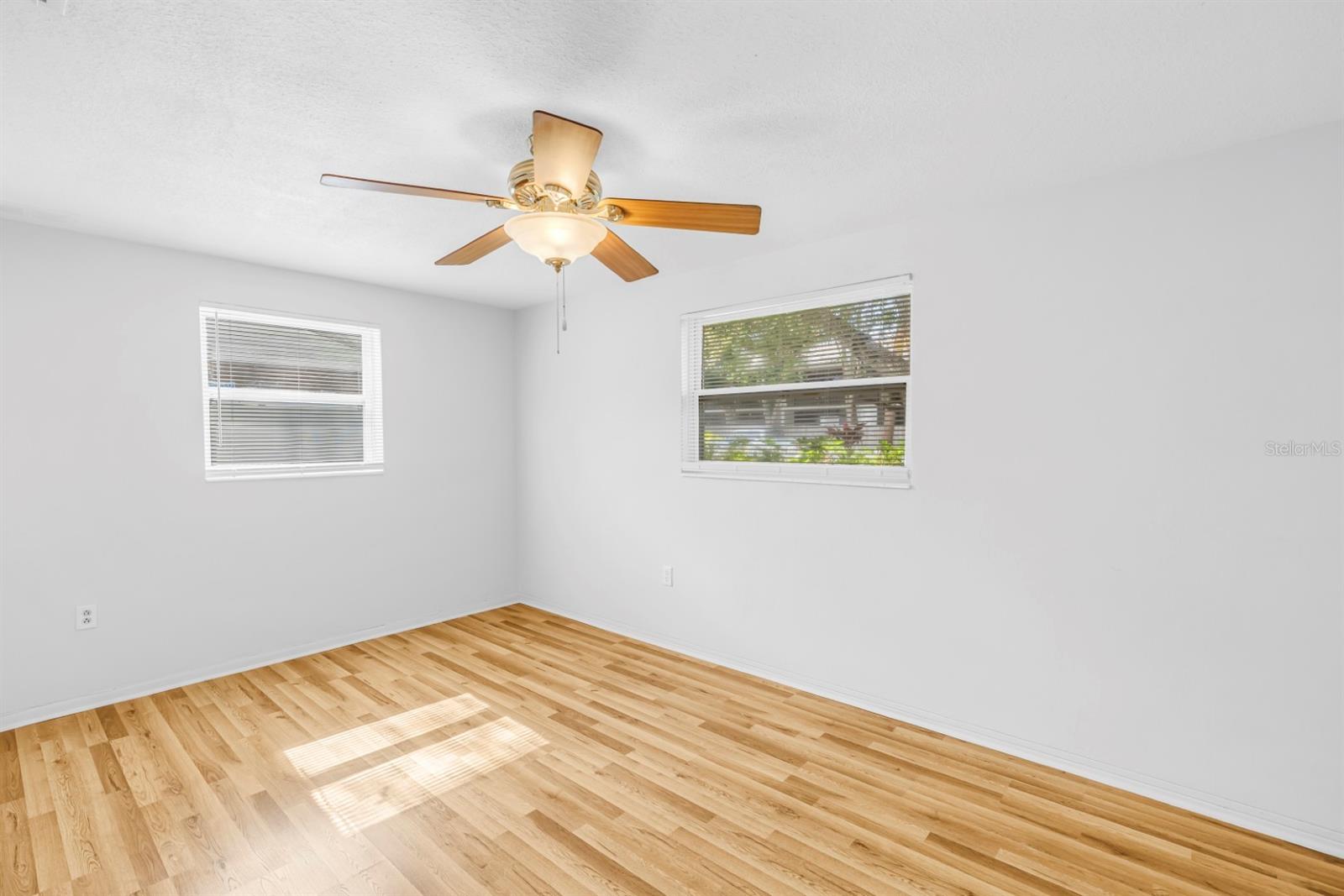 Primary bedroom filled with natural light