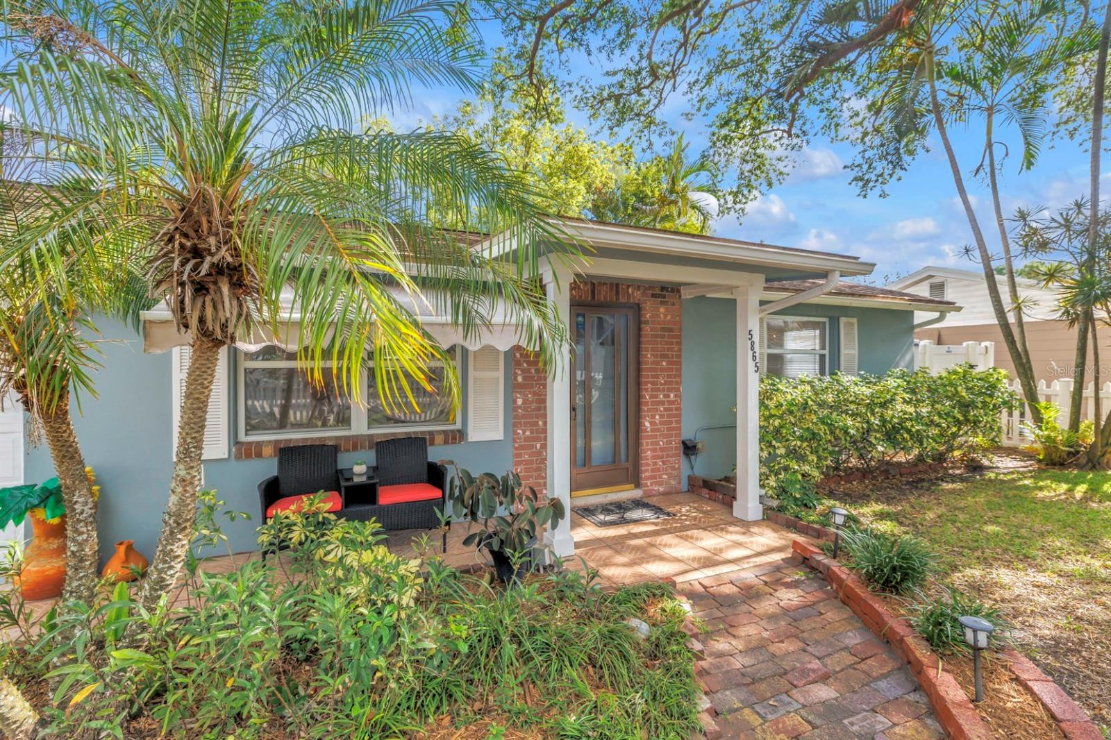 Follow the brick walkway to a welcoming covered front porch and inviting entry