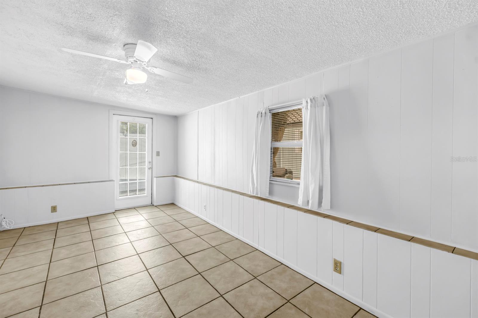 Third bedroom with access to the backyard