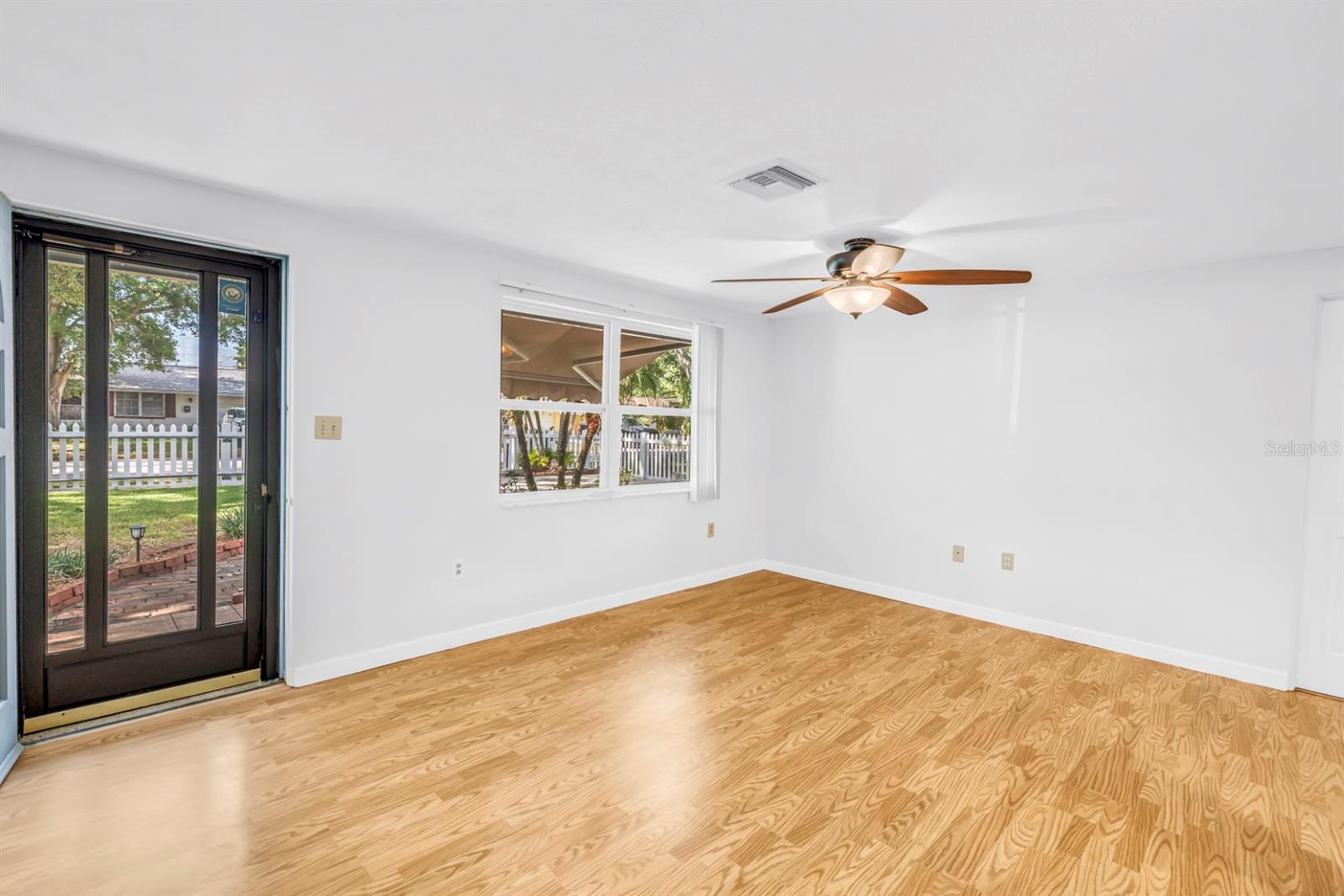 Living room features glass door with optional screen door insert