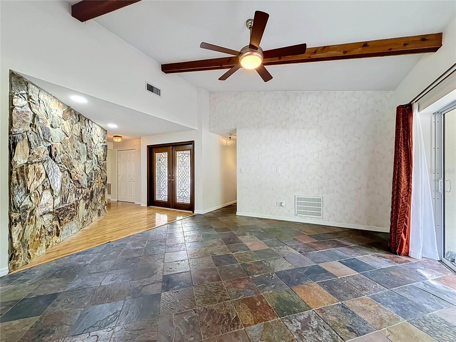 Double Decorative Entry Doors - Entryway with stone accent wall
