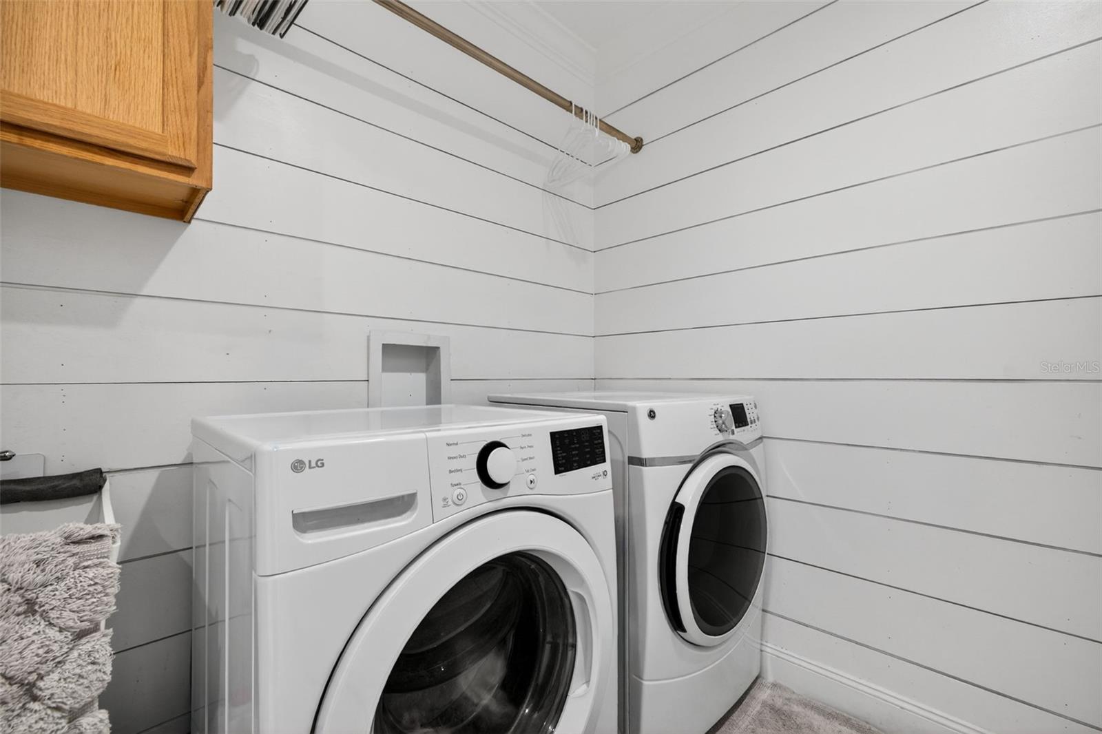 Central laundry room with ship lap walls