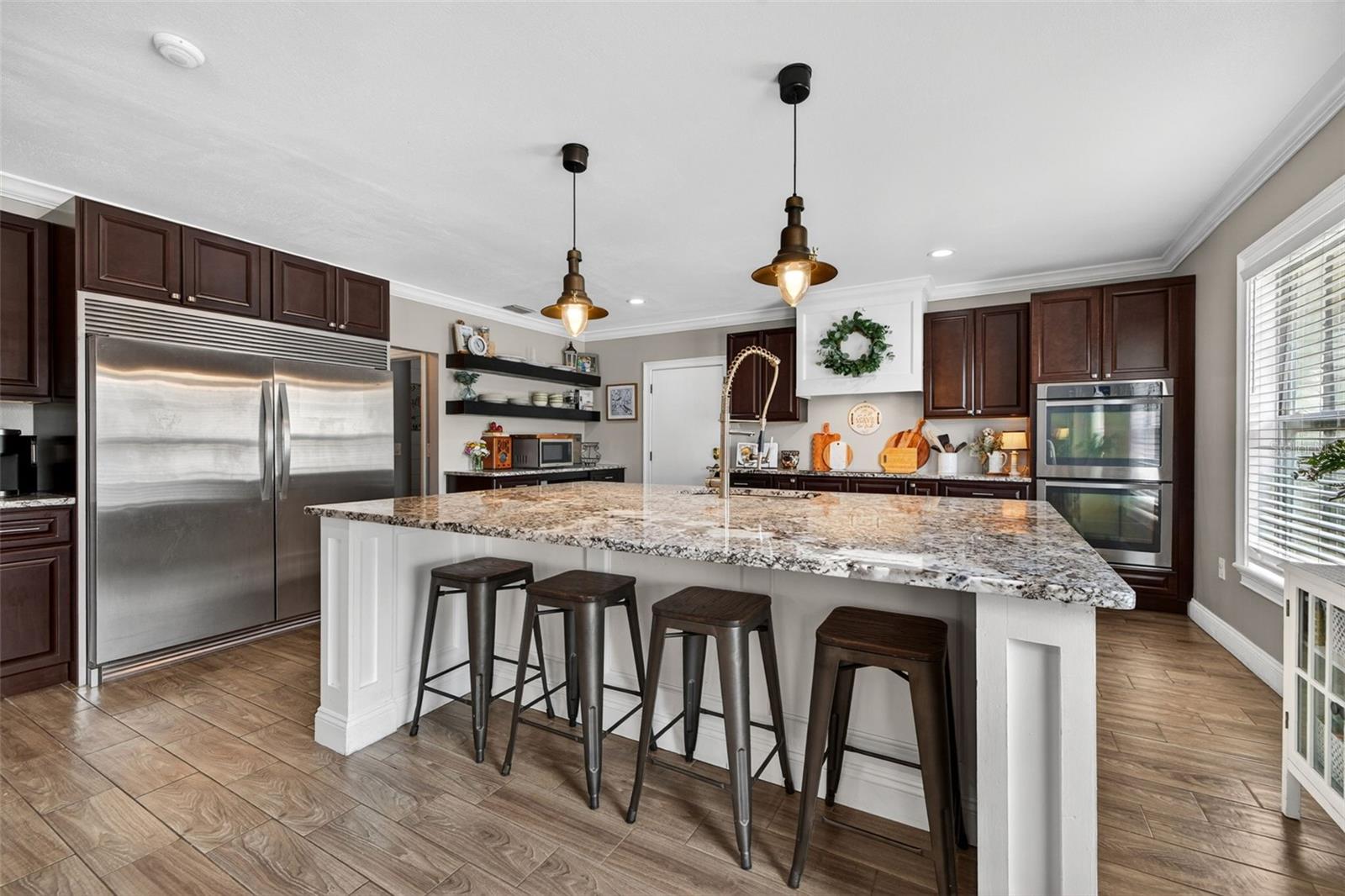Stunning kitchen with oversized granite counter island