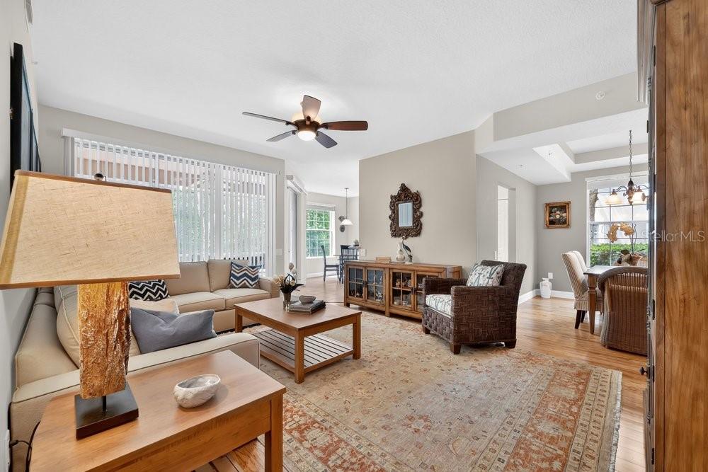 Living area drenched in natural light w dining area
