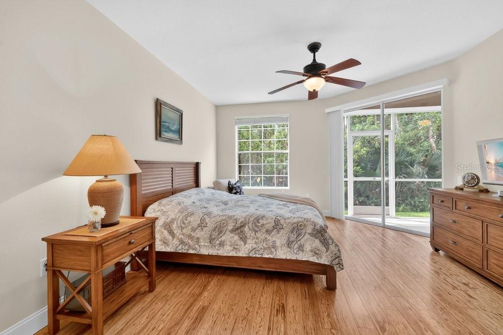 Spacious Primary Bedroom light and bright w lanai access, Ethan Allen Bedroom set conveys.