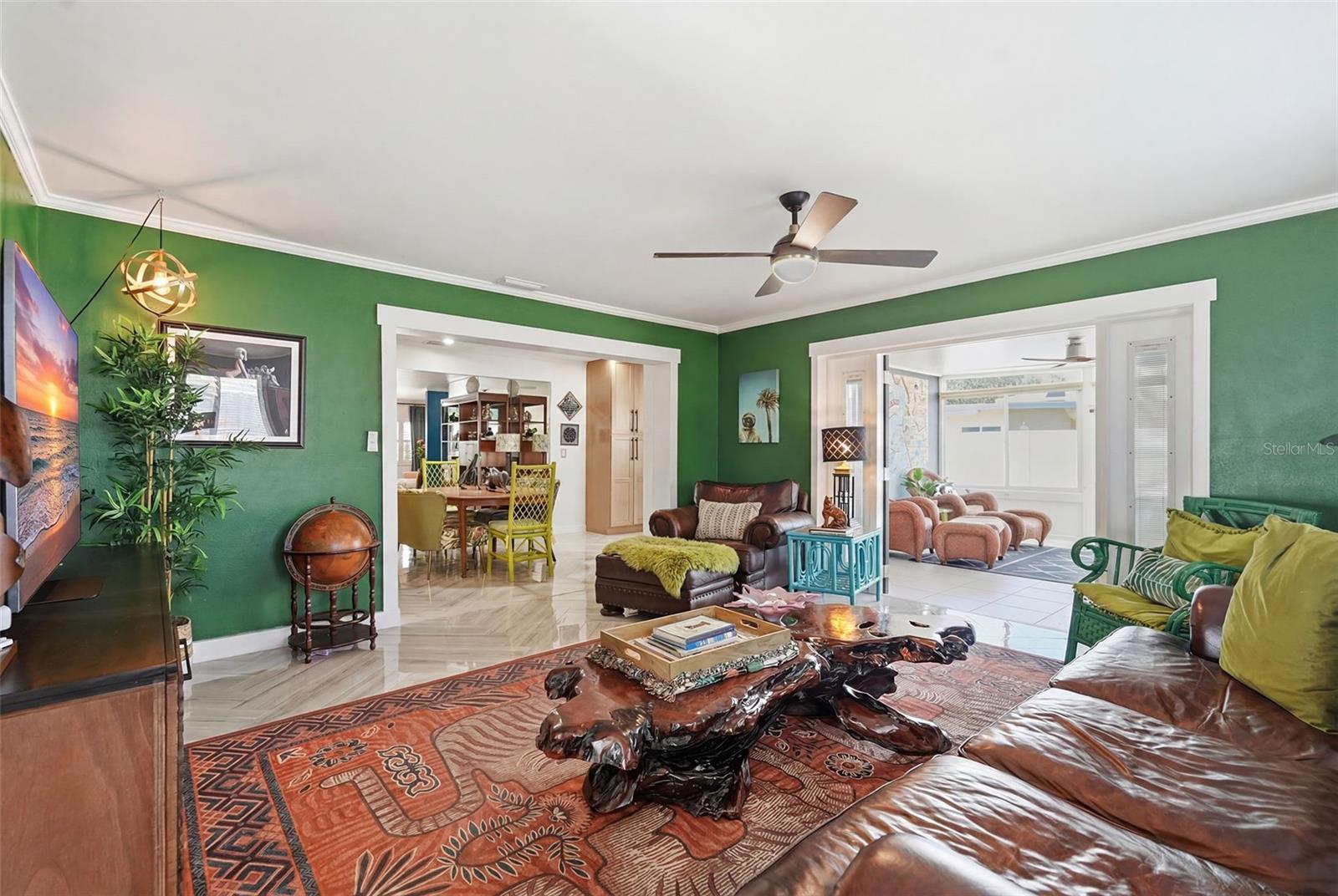 A nod to Elvis’ iconic Jungle Room, this moody lounge layers rich color, bold personality, and vintage-inspired flair.