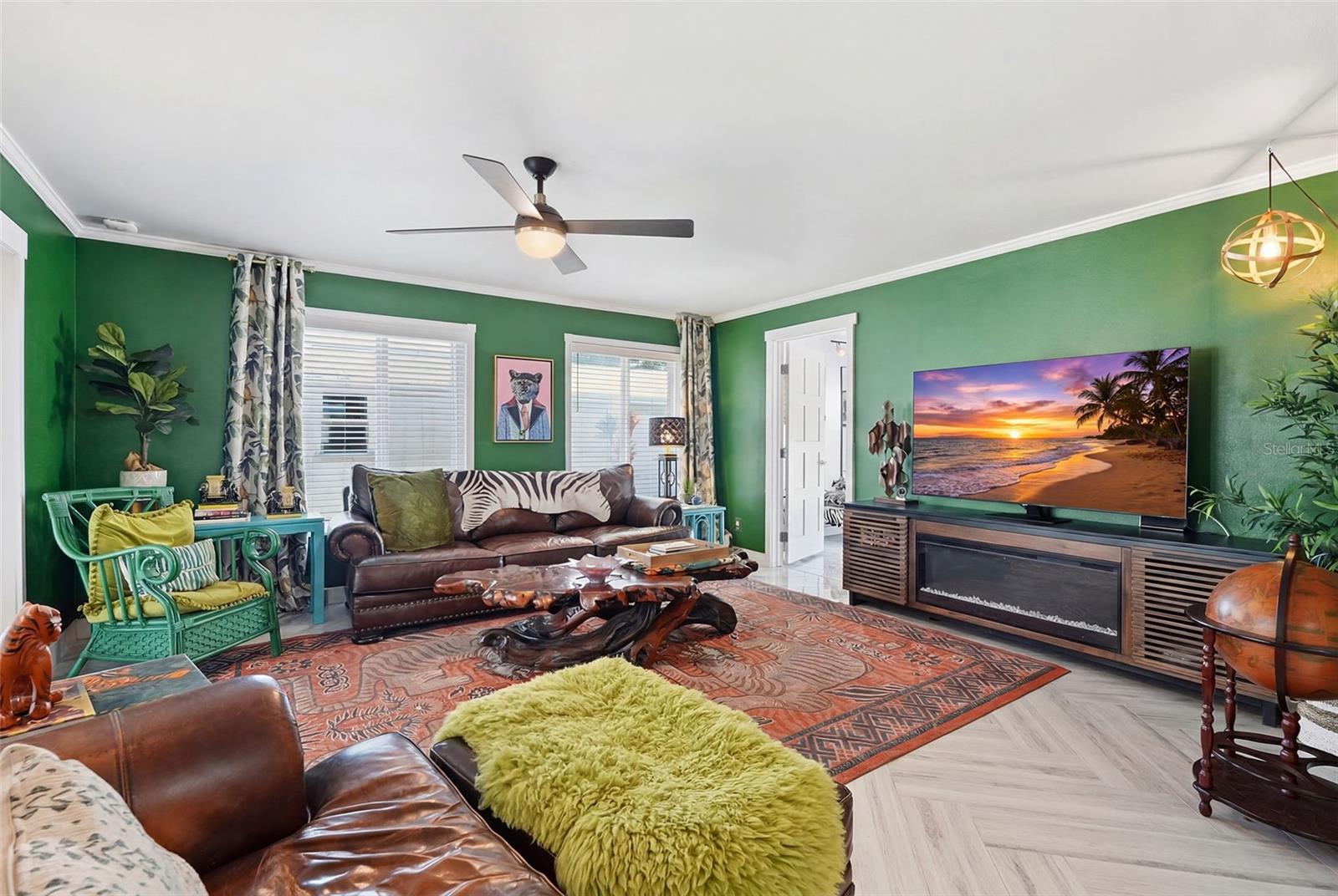 A nod to Elvis’ iconic Jungle Room, this moody lounge layers rich color, bold personality, and vintage-inspired flair.